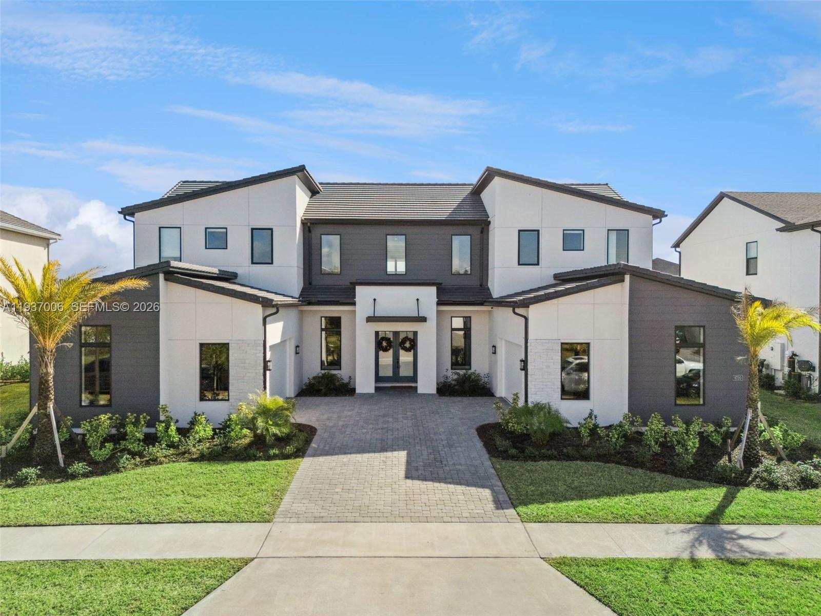 Welcome to refined luxury living at 9320 Laurel Berry Drive, an elegant contemporary residence designed for both sophistication and comfort. This stunning home showcases striking modern architecture, clean lines, and exceptional curb appeal, complemented by professional landscaping and a welcoming private entry.

Inside, the residence offers expansive living spaces filled with natural light, high ceilings, and premium finishes throughout. The thoughtfully designed floor plan provides seamless flow for entertaining and everyday living, featuring spacious bedrooms, spa-inspired bathrooms, and designer details that elevate every room.

The gourmet kitchen serves as the heart of the home, ideal for hosting and culinary enjoyment, while the open-concept living areas extend effortlessly to the outdoors. Located in a highly desirable community, this property offers convenience to top-rated schools, dining, shopping, and major roadways, all while maintaining a sense of privacy and exclusivity.

A rare opportunity to own a modern luxury home where style, comfort, and location come together seamlessly. Schedule your private showing today.