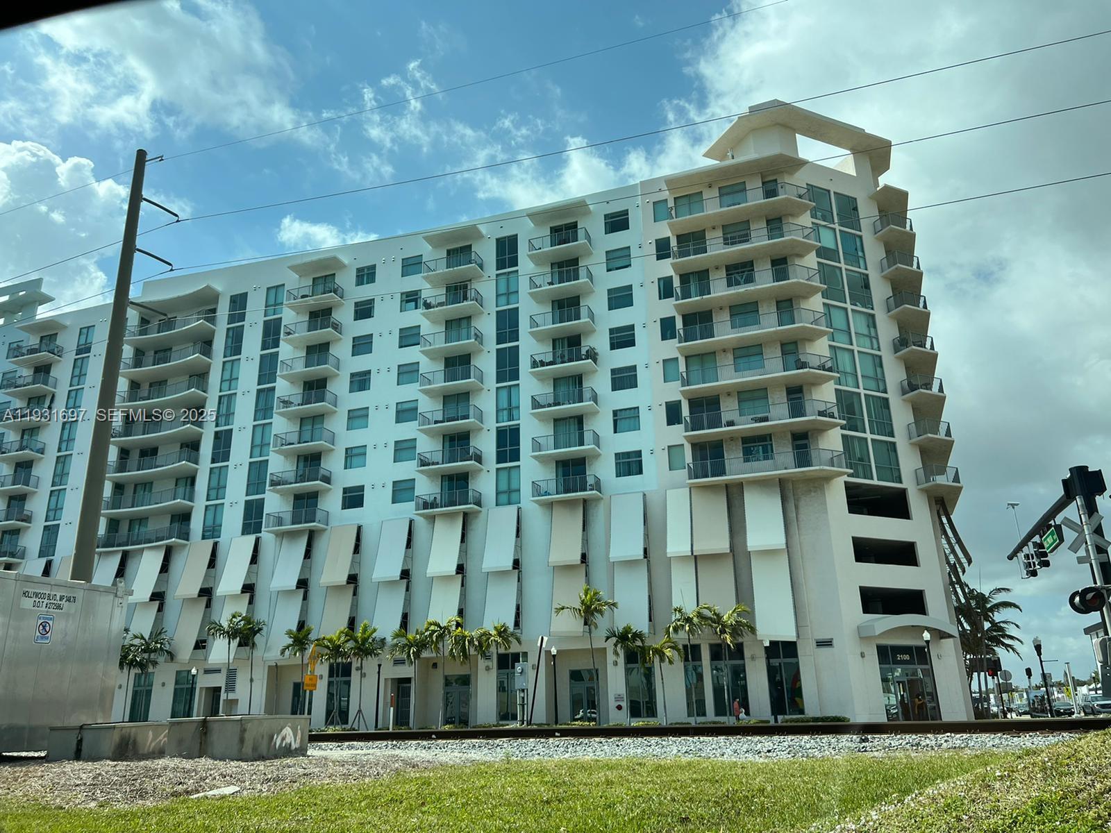 Live in the hearth of downtown Hollywood! Bright and tastefully upgraded unit with amazing city views. 2/2 Spilt Floor plan. Granite Kitchen, Travertine kitchen floors, NEW  AC unit. Main bathroom offers stand up shower and separate Jacuzzi tub. Washer/Dryer in Unit. Amazing Views from Balcony. This unit is in perfect condition to move in! Building offers 24-hour concierge, valet parking, gym, pool, sport lounge with pool table, covered garage parking. GREAT INVESTORS OPPORTUNITY, RENT FIRST YEAR OK. Walking distance to restaurants, supermarkets, and 3 miles to the beach!