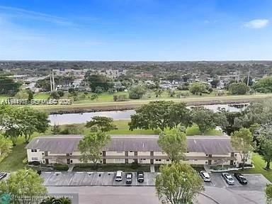 Back on Market! Second Floor corner unit, Canal view from 2 sides. Unit has been stripped and is ready for your creative touch. 55+ community, no rentals. One assigned parking space, with ample guest parking. Extra Storage Locker, Laundry room, Basic Cable and Water are included. Association Requires a 20% Down Payment, and Security Deposit of 6 months HOA, to be Refunded after 18 Months. In Person Interview Required. Realtors: make Buyer aware unit is gutted and needs full rehab