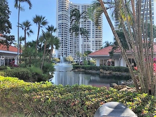 High-floor 2-bedroom, 2-bath residence in sought-after Mystic Pointe with tranquil canal and Turnberry Country Club golf course views. The renovated open kitchen features a breakfast bar, stainless steel appliances, updated bathrooms, spacious walk-in closet, and an in-unit washer/dryer. Enjoy resort-style amenities including a renovated fitness center, pool, sauna, tennis, pickleball, marina, waterfront walking paths, café, convenience store, 24-hour gated security, concierge, and on-site management. Ideally located in the heart of Aventura, just minutes from Aventura Mall, dining, parks, and the beaches.