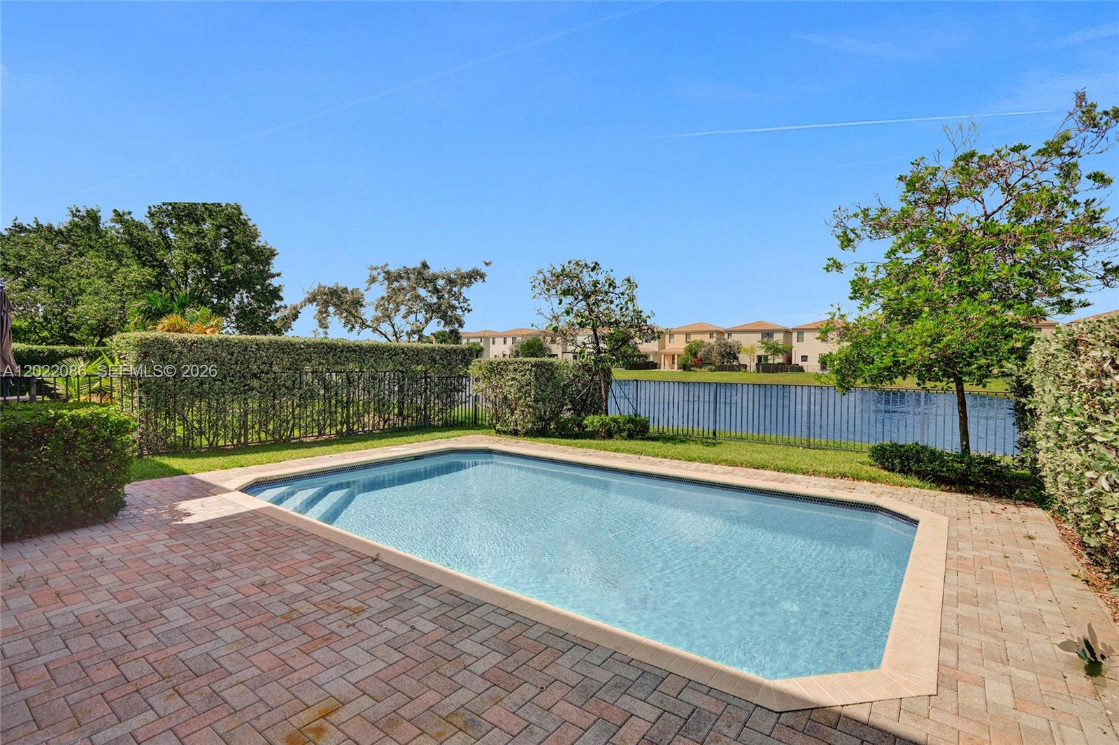 STUNNING LAKEFRONT POOL HOME IN THE DESIRABLE GATED COMMUNITY OF AVENTURA ISLES! This beautiful 4 Beds, 2.5 Baths residence with a 2-car garage features a bright open floor plan, spacious living areas, and a gorgeous kitchen with granite countertops and stainless steel appliances. The living room and kitchen overlook breathtaking views of the pool and lake, creating the perfect setting for entertaining and relaxing. Laminate wood and tile flooring throughout, generously sized bedrooms, and ample closet space. Enjoy resort-style community amenities including tennis courts, community pool, playground, and more. Maintenance includes cable, internet, security, lawn care, and all amenities***EASY TO SHOW**SEE BROKER REMARKS FOR SHOWING INSTRUCTIONS**PRESENT OFFERS