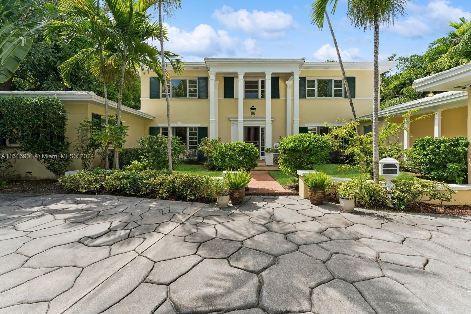 Classic elegance & premier Island location across the street from the bay, this spacious & airy Bay Point home is a rare find. Enter through a stately two story foyer w/a grand circular marble staircase, oversized living room, dining room, & expansive family room w/wet bar overlooking the pool & garden The kitchen wing features a butler's pantry & breakfast room for everyday dining. Upstairs consists of 2 primary bedrooms w/ensuite baths, walk-in closets & a separate dressing room. Downstairs bedroom wing offers 2 bedrooms w/ensuite bathrooms connected by a library/playroom & wet bar. Additional features include private office, cabana bath, staff quarters w/private bath, laundry/mudroom & a covered loggia leading to a 2 car garage w/full
bath.