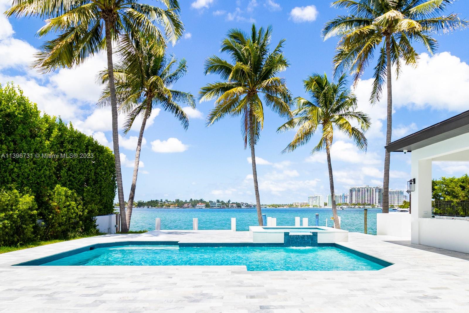 Newly renovated modern transitional estate with open bay views on exclusive Hibiscus Island with 60ft of waterfront. This entertainers oasis features a smart pool, jacuzzi, cabana, top-of-the-line outdoor summer kitchen, 5-zone surround sound, and lush landscaping. White oak and marble finishings throughout, illuminated but floor-to-ceiling windows. This 6 bed, 6 bath, 2 powder room residence includes a large primary suite with marble adorned ensuite with large double vanity and free-standing floating tub overlooking the water. North-facing views capture stunning sunrises and sunsets.