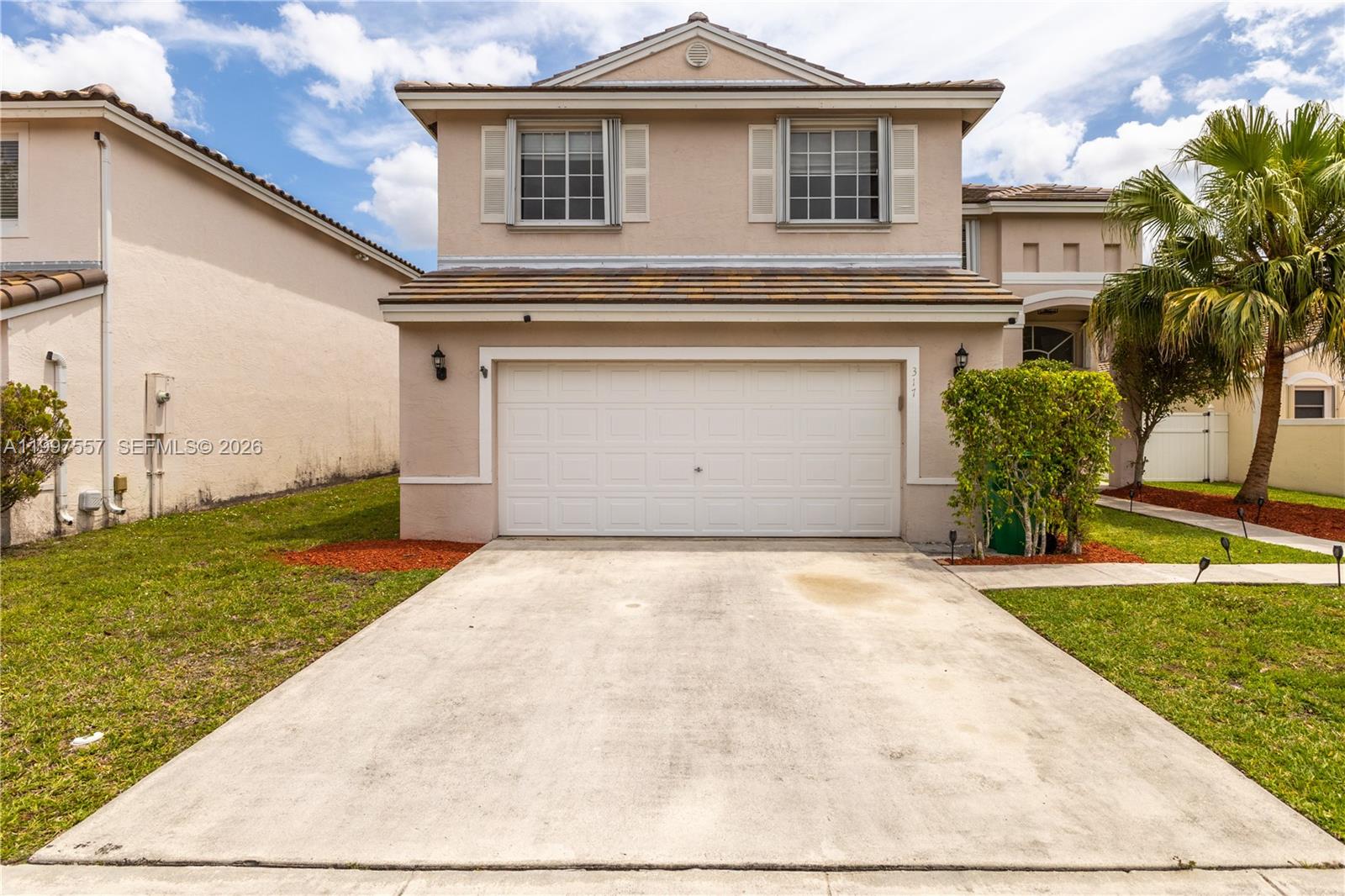 Beautifully maintained Pembroke Pines home located in a gated community. This property features a 2025 roof, 2019 AC, 2017 water heater, impact-rated front door and accordion shutters for added protection. Interior highlights include granite countertops, solid wood cabinetry, and a spacious layout with great natural light and functional flow. Complete with a 2-car garage, this home is ready for a new owner to make it their own. Ideally located in a highly desirable area of Pembroke Pines near A-rated schools, beautiful parks, and family-friendly neighborhoods. Just minutes to Pembroke Lakes Mall, The Shops at Pembroke Gardens, CB Smith Park, and a wide variety of dining and entertainment options. Convenient access to I-75 makes commuting easy while still enjoying a quiet, well-kept community setting.