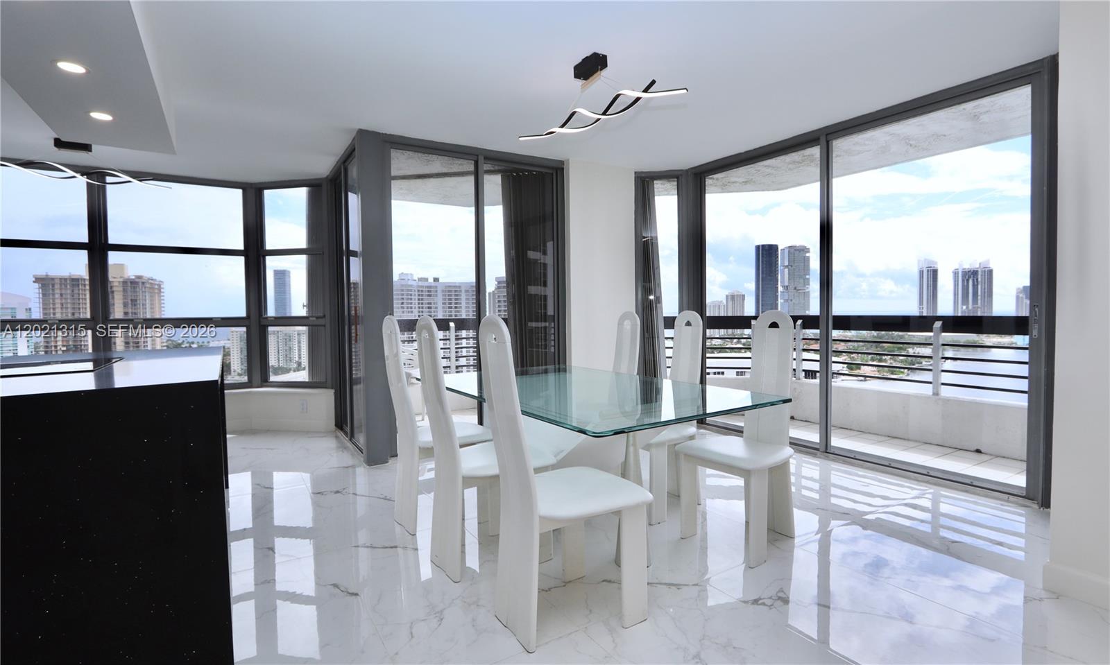Spectacular renovated 2BR/2BA corner unit with unobstructed panoramic SE views and ocean and intracoastal views from every room! Immaculate kitchen with waterfall countertop. Split floor plan offers privacy, with a spacious primary suite, ensuite bath, and custom walk-in closets. No detail spared—this elegant, functional home is a rare gem. Enjoy resort-style living in the coveted Mystic Pointe community with marina, fitness center, heated pool, library, 7 clay tennis courts, 4 pickleball courts, basketball court, dog park, mini market, a beauty salon, e-car charging stations, and on-site restaurant and  a convenience shop.