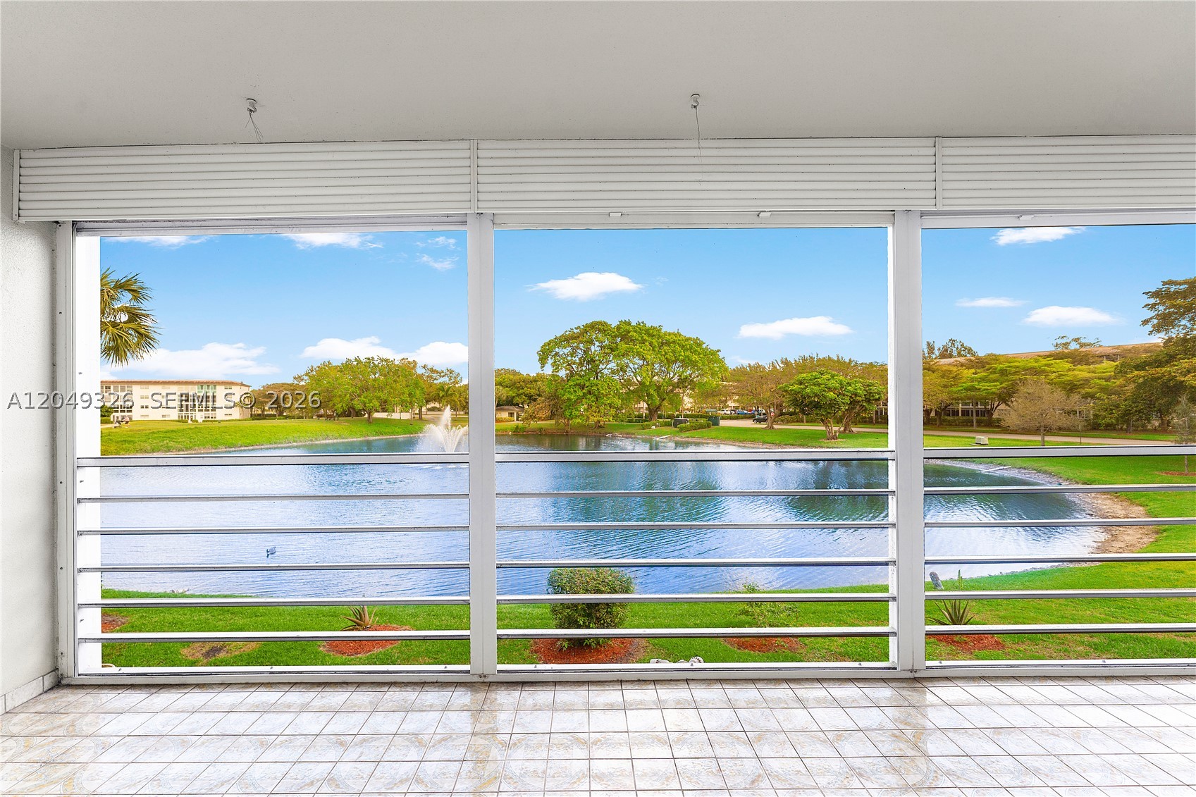 Beautiful 2-bedroom, 2-bath condo located in a desirable 55+ community. The unit features a renovated kitchen and updated bathrooms, bright living and dining areas, and an open kitchen layout that creates a spacious feel. Enjoy your private porch with peaceful lake views, perfect for relaxing. The unit also includes assigned parking and plenty of natural light throughout. This resort-style community offers golf, pool, gym, theater, courtesy bus service, and many social activities, providing an active and vibrant lifestyle. Conveniently located near the golf course and community amenities. Great opportunity to enjoy comfortable living in a welcoming and active 55+ community.
