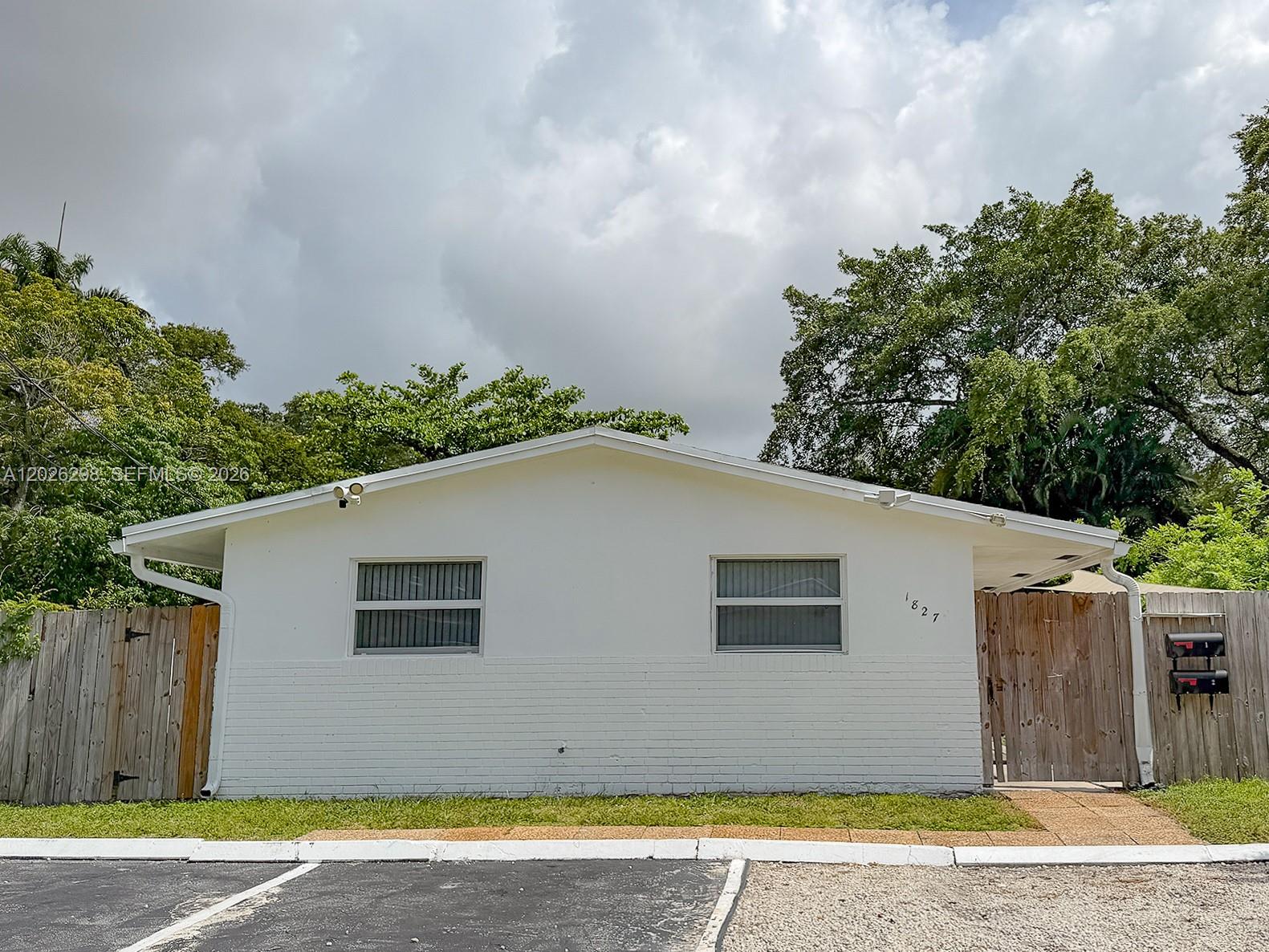 Renovated duplex in Fort Lauderdale's coveted River Oaks neighborhood — just ONE block from Safe Harbour Lauderdale Marina, 5 blocks from I-95, 10 min to FLL Airport & 15 min to the beach. This 1,570 SF property offers 2 bed/1 bath per unit with a complete 2024–2025 gut renovation: all-new kitchens, bathrooms, plumbing, electrical, impact windows & doors, and roof. Original terrazzo floors and C.B. Stucco construction built to last. Unit 1 is VACANT and move-in ready. Unit 2 is tenant-leased at $2,700/mo through September 2026. Tenants pay ALL utilities. Each unit has its own separate electric & water meter. Stabilized gross income: $64,800/year. Active Short-Term Rental license (through Dec 2026) unlocks serious upside — Unit 1's 6 beds have generated up to $3,000/mo via by-the-bed rentals, fueled by the marina workforce next door. Total monthly income potential: $5,400+. Perfect for investors seeking turn-key ROI or first-time buyers who want to live in one unit and rent the other. The surrounding area is actively gentrifying — older properties replaced by modern 2-story homes and townhome-style duplexes, driving strong land value appreciation. Rare income-producing gem in one of Fort Lauderdale's most strategic locations.
