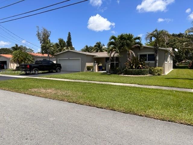 Completely Remodeled Recently upgraded home in highly desirable Cooper City. Quiet street, great neighbors. White Porcelain tile flooring throughout, newer roof, all impact windows and doors throughout. Panoramic view of the canal and yard from all rooms. The kitchen has the new soft-close shaker-style 42" cabinets in expresso with white quartz counters and white subway tile backsplash. Both bathrooms have been remodeled with a huge walk-in shower in the main bath. Walk to all 3 schools (Cooper City Elem, Pioneer Middle, Cooper City High) as well as parks and jog/bike paths all over Cooper City.  Note: Property is larger than tax rolls as the laundry room was added to the home from the garage, See attached floor plan. 24 hr notice, please. Available May 1st.