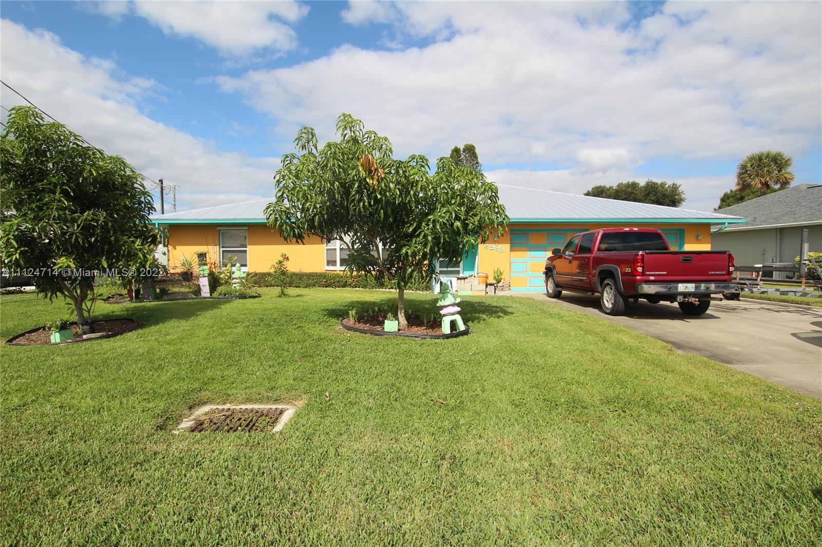 LAKE OKEECHOBEE ACCESS -Taylor Creek Isles 3/2 CBS house. Open concept and very spacious home.Plenty of counter space and cabinets,including a pantry. Ceiling fans in each room. Master suite has walk-in closet/bathroom and shower. Storage room with large closet. Guest bdrs have closets and a full bathroom separating them. Closet inside bathroom and in the hallway. Closed in Florida room, under air, with sliding doors leading to deck, then down to Boat dock. Boat lift, new motor 2019.  Fish cleaning station,numerous electical outlets. Large 2 car garage, shelves for storage. Laundry hookups in garage. Storage shed on side of house. Roof replaced August 2021. 3 zone irrigation system with an automatic timer that runs off canal water. Close to town, doctors, restaurants, and all activities.