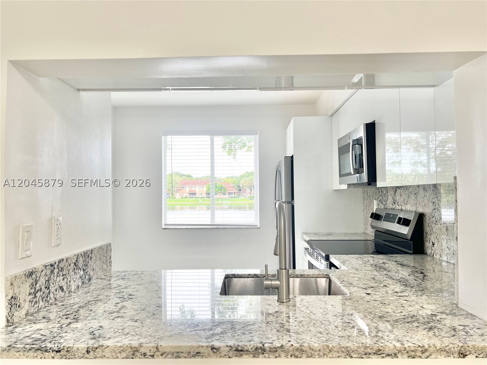 Beautifully remodeled 2-bedroom, 2-bathroom condo with a beautiful lake view, featuring a spacious and bright living area. Enjoy the convenience of an in-unit washer and dryer, modern finishes, and a functional layout designed for comfortable living. Relax while taking in the serene waterfront setting. Ideally located near shopping, restaurants, supermarkets, major highways, and Sawgrass Mills Outlet, offering the perfect combination of comfort convenience, and location.