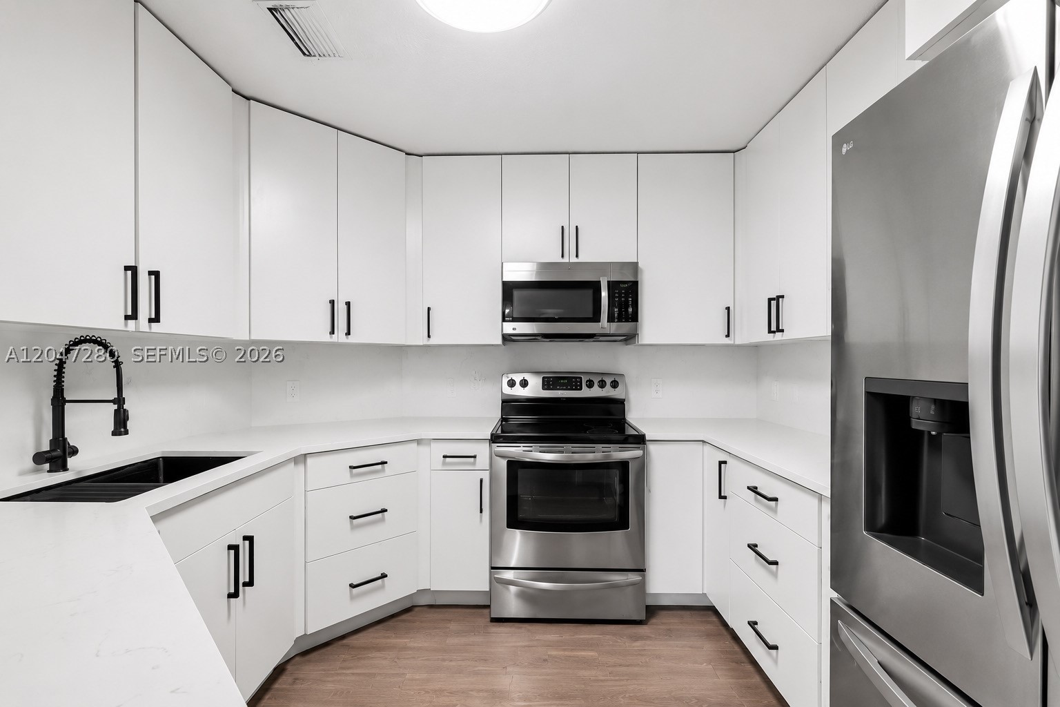 Beautifully updated 2-bedroom, 2-bathroom townhouse in the desirable Sunset Harbour community. This move-in ready home features impact windows, a beautifully updated kitchen with quartz countertops and a farmhouse drop sink, modern finishes throughout, renovated bathrooms, laminate flooring, a new washer and dryer, and a new roof replaced at the end of 2024. Enjoy a bright, open layout and a private fenced patio perfect for relaxing or entertaining. Conveniently located near shopping, dining, top-rated schools, parks, and major highways, with access to community amenities including a pool, tennis courts, basketball courts, clubhouse, and playground. A wonderful opportunity to own in one of the area's most desirable communities.