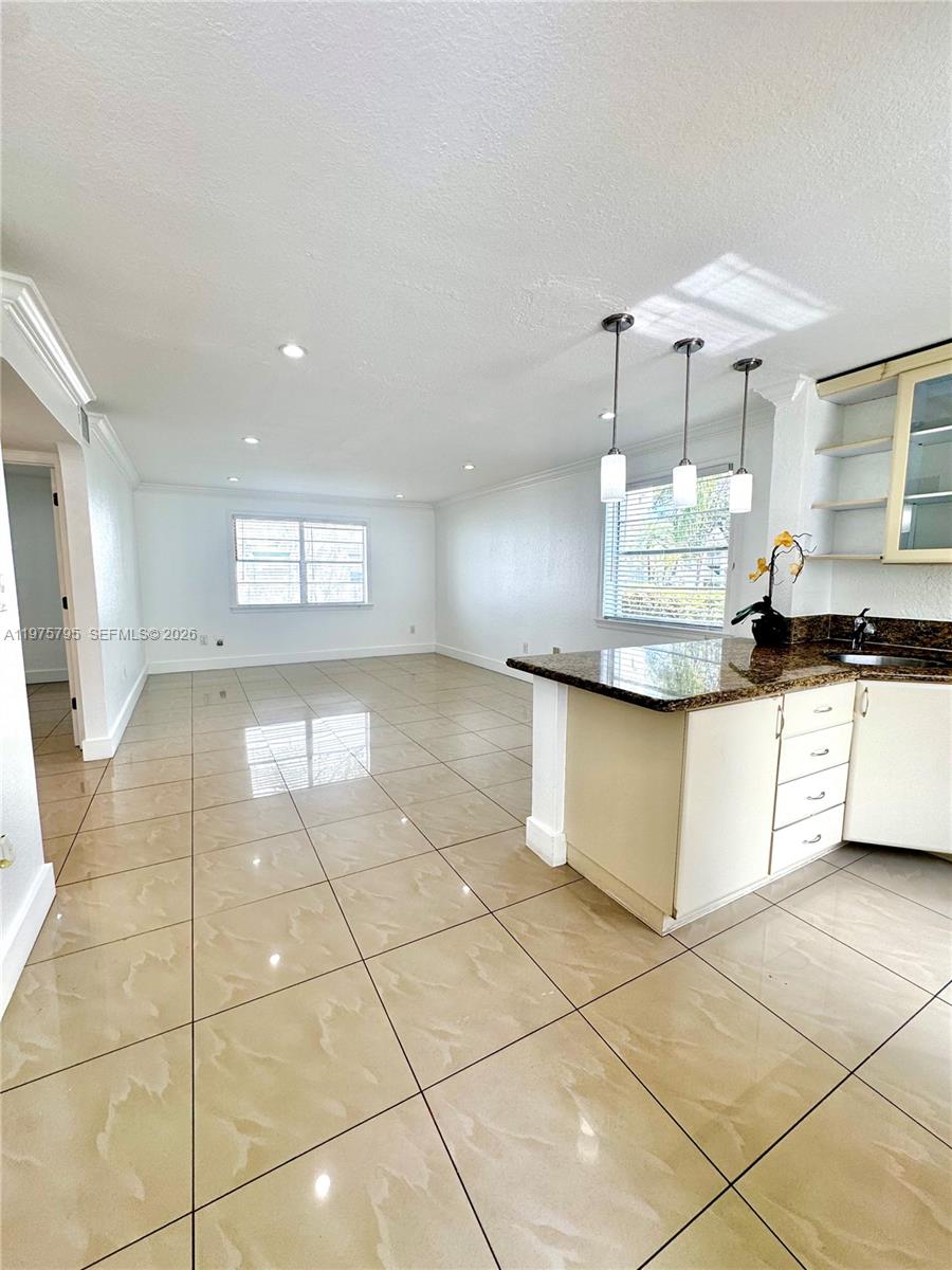 Welcome to this Stunning unit in the heart of Palmetto Bay! This charming & updated 2 bedrooms, 1 Bathroom unit features an open concept kitchen with granite counter top and stainless steel appliances, that connects the kitchen, living and dining areas. Updated spa-like bathroom shines with glass enclosed shower. Great fenced complex community. Excellent amenities including pool, children play area and laundry facilities. Conveniently located in Palmetto Bay offering easy access to US-1, Turnpike Old Cutler road, close to the falls, restaurants and shops! A must see!