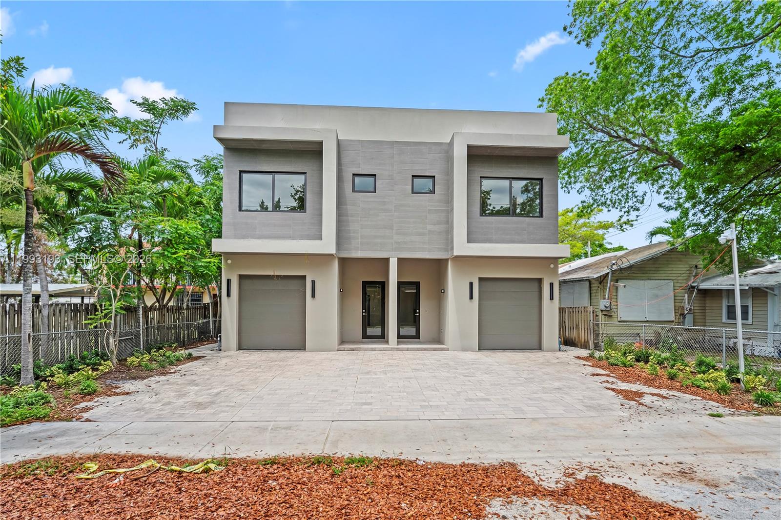 Stunning new construction three-story townhouse offering refined design and exceptional indoor-outdoor living. This 3-bedroom, 3.5-bath residence showcases an open-concept kitchen with custom millwork, sleek cabinetry, and premium finishes throughout. Expansive living and dining areas seamlessly flow to a private backyard, perfect for entertaining. The second level features well-appointed bedrooms with walk-in closets and beautifully designed contemporary bathrooms. The crown jewel is the private rooftop retreat, complete with a pool, lounge areas, and optional canopy ideal for relaxing or hosting under the Miami skyline. High-performance impact windows, a smooth stucco façade, and thoughtful architectural details further elevate this impressive home. Ideally located just minutes from Coconut Grove, Coral Gables, and Brickell.