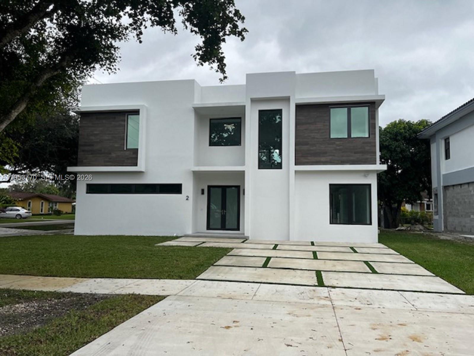 Stunning corner NEW home in the heart of Miami Springs. 4 Bedrooms / 5 bathrooms. 2-car garage. Modern
design new construction with high-end finishes and design. It is centrally located, easy access to the major
expressways and MIA airport. NO HOA fees. Residents have access to Miami Springs Recreation Center, with gym
and pool. Features: open floor plan between kitchen, living area and dining area, marble staircase, glass railings,
impact-resistant windows and doors, 36 x 72 porcelain flooring throughout, 1 master bedroom downstairs, great
for in-law or teenager, 1 master bedroom upstairs, all bedrooms have its own bathroom, high-end bathroom
fixtures, granite countertops in kitchen, stainless steel appliances. Home has 3,350 sqft. living area, lot is 7,050
sqft.