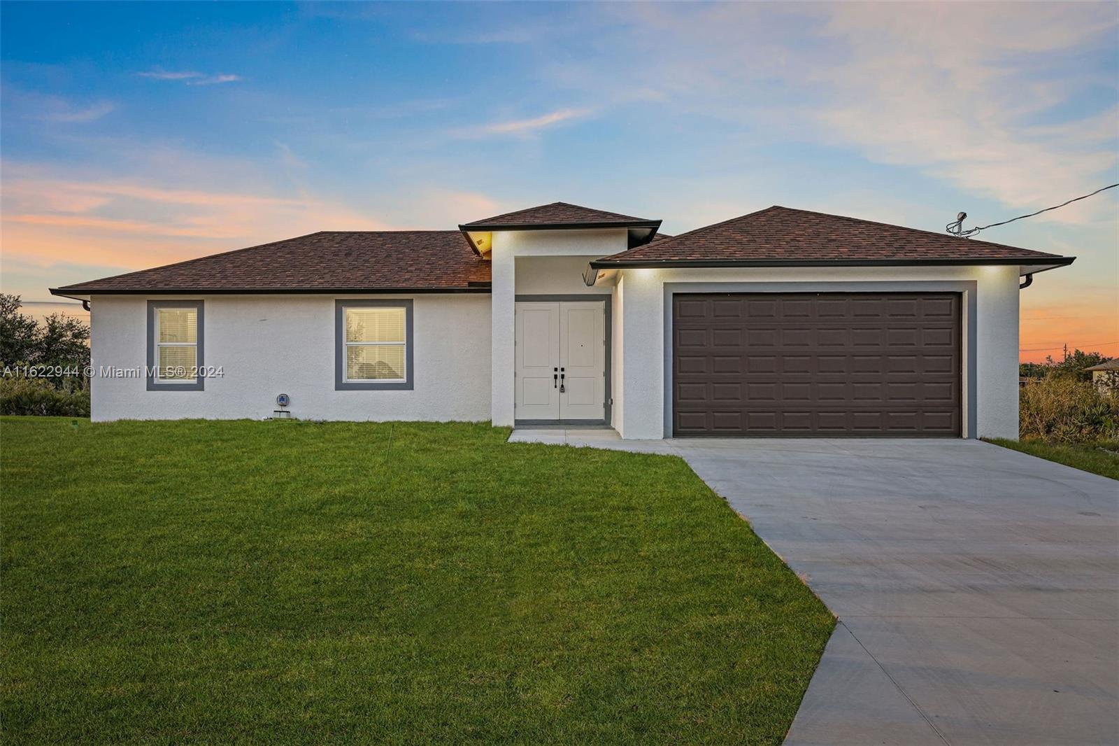 BRAND NEW HOME, NO HOA, NO CDD, This beautiful, upgraded home features elegant white tile throughout—no cheap carpets here! It includes a laundry room, water filtration system, and a two-car garage. Exterior night lights and impact windows add to the home's appeal. You might qualify for a Zero Down Payment Loan with our preferred lender. Our homes are moving quickly, so don’t miss out! We have 3-bedroom and 4-bedroom models available. Plus, enjoy peace of mind with a 10-year structural warranty (policy available for review). Come see it today!