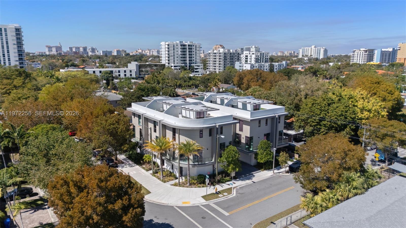 Major Price Adjustment! Caliza Townhomes, a boutique enclave of six new construction modern residences steps from Coconut Grove, the newly developed underline, Brickell and Downtown Miami in the highly desirable Silver Grove neighborhood. This 3 bed/3 bath townhome with over 2,400 SQ FT has 10 FT ceilinigs throughout the three interior levels. This is the best unit in the development, this rounded corner unit has more windows than the other units, which floods this home with an abundance of natural light. Upon entering this townhome you feel a sense of space in the large foyer with a true 2 car side by side garage and a laundry/storage room. The open modern floorplan on your main level is perfect for entertaining. The stunning roof top terrace that has mesmorizing  downtown, Brickell, South Beach and Coconut Grove views. The rooftop is the perfect setting for catching some rays or gazing at the stars. Enjoy all of the benefits of townhome living that feels like a single family home.