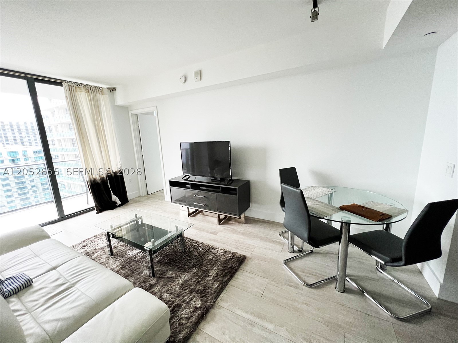 Located in the heart of Midtown, with restaurants, and shops. Newer construction at the Hyde Residence and ready to move in this 1 bedroom 1 bath. The upgraded kitchen includes stainless steel appliances. Large balcony with beautiful view, which overlooks Midtown, Edgewater, and bay. Private Washer/Dryer. 1 Assigned Parking. The Hyde offers 5-Star amenities, a pool, full gym, 24-hour valet parking, a business center, spa, playroom, and business center. Fully furnished with short-term or one-year lease options.