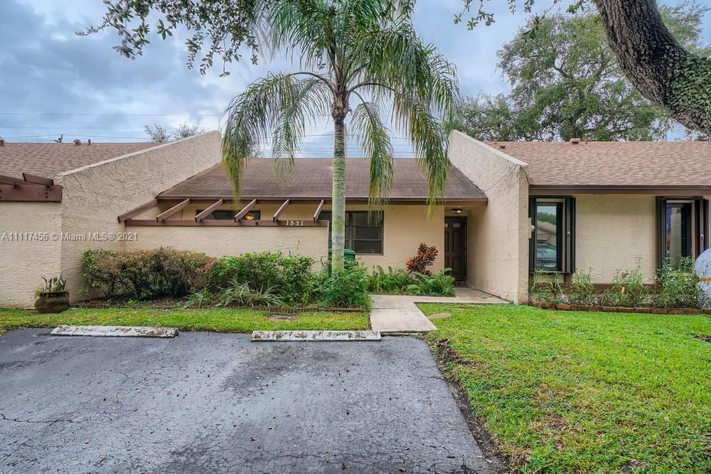This fantastic 2 bedroom, 1.5 bathroom townhome is located in the desirable East Lakes Pembroke Pines! Sleek flooring, vaulted ceilings, an abundance of light, and welcoming open living space greet you as you enter. The well-acquainted galley kitchen is ready for you to prepare meals for guests. Venture out onto the private patio and sip your morning coffee or entertain in your private fenced back yard. The spacious primary bedroom features a sizable closet and a fabulous en-suite bathroom. This home is conveniently located near Pembroke Lakes Mall, eateries, schools, parks, and hospitals. Do not miss the opportunity to see this impressive townhome!