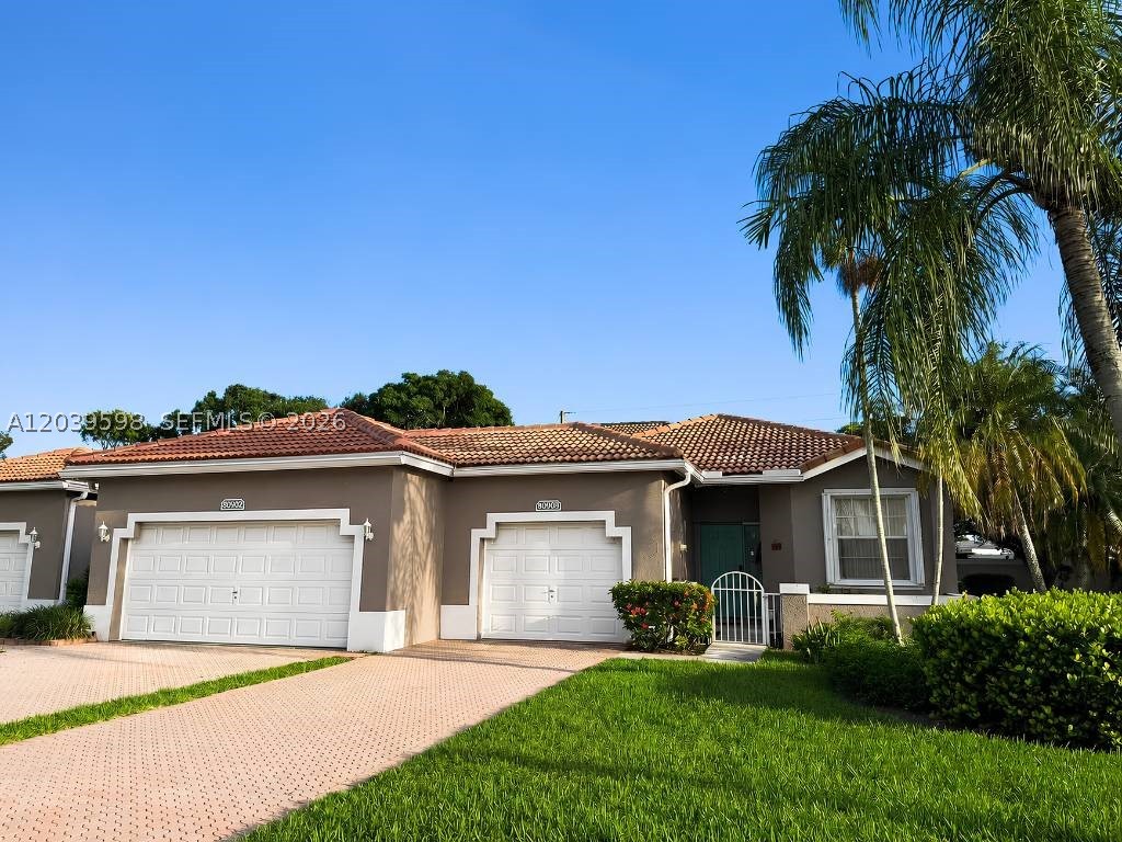 Beautiful Villa with 2 bedrooms, 2 bathrooms and a 1 car Garage. Vaulted ceiling through out. Ceramic tile in foyer and kitchen, carpet in bedrooms and living room. Large eat-in kitchen. Separate laundry room with full size washer and dryer. Large master bedroom with a sitting area and two large closets. Newer AC and Water Heater. Association fee covers cable tv, security alarm, painting of exterior, pressure washing of roof, security patrol, basketball court, tennis court, 2 pools, gym, and club house. Community is one of the best kept secrets of Sunrise. Don't miss out! Property is leased until Dec. 14, 2026