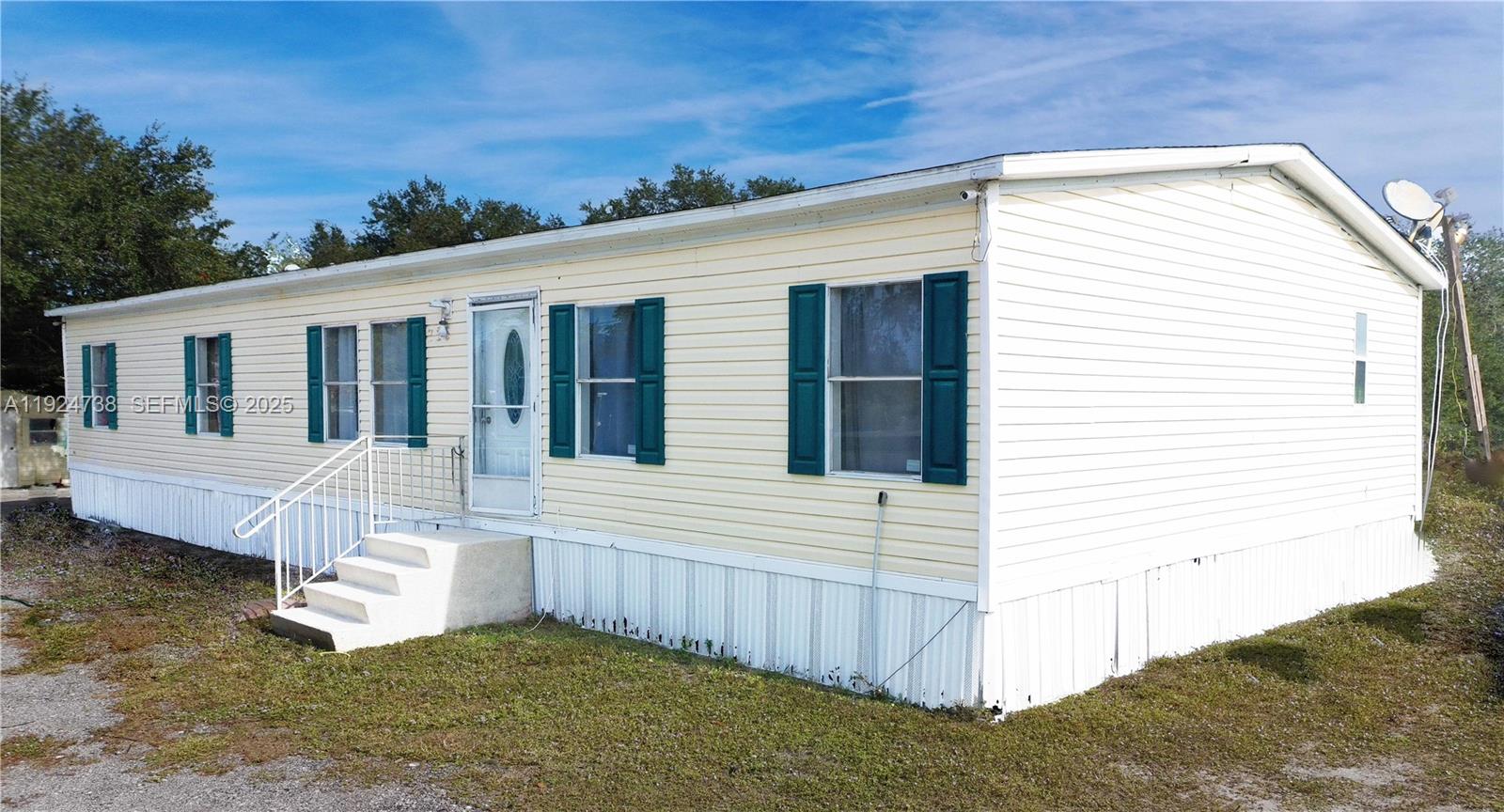 AMAZING OPPORTUNITY TO BUY THIS MANUFACTURE-HOME IN MONTURA RANCH. This home is situated in a private fenced  lot (0.94 Acres), with the BEST of living in a rural setting. This double wide manufactured home has spacious living area with 4 bedrooms and 2 bathrooms. It has trees, fruit trees, fenced areas for raising animals, and plenty of space for your projects. 
Montura Ranch Estates is a rural community of South Central Florida in Hendry County residing between the cities of Clewiston and LaBelle. Centrally located within 1-1.5 hours from Miami, Naples, Fort Myers, Cape Coral, Fort Lauderdale, West Palm Beach, Port Charlotte and Okeechobee.