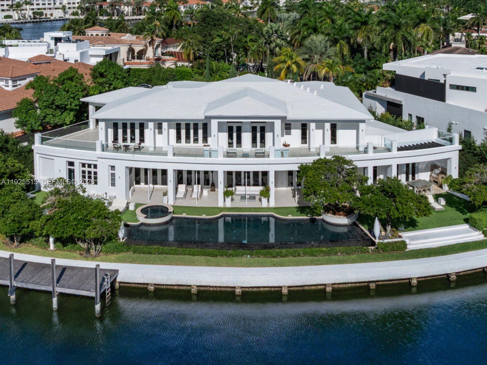 Step Inside With Me! This Golden Beach custom-built waterfront estate exudes a stately grandeur along an impressive 186' on the coveted Southern canal. A classic foyer reveals 25' ceilings and a regal staircase leading to over 8,700SF of glamorous interiors defined by a significant salon, formal dining, study, and theatre.  The primary wing boasts spacious designated wardrobes and dual baths adorned with marble. The wellness pavilion features fitness, sauna, steam, and plunge pool which extends to a 100ft saltwater pool. Outdoors, find beautifully manicured landscaping, an expansive loggia with Summer kitchen, and private dock. Premium Crestron automation, wine cellar, butler's pantry, elevator, and 2 garages in a cul-de-sac location complete this prestigious offering in a gated community.