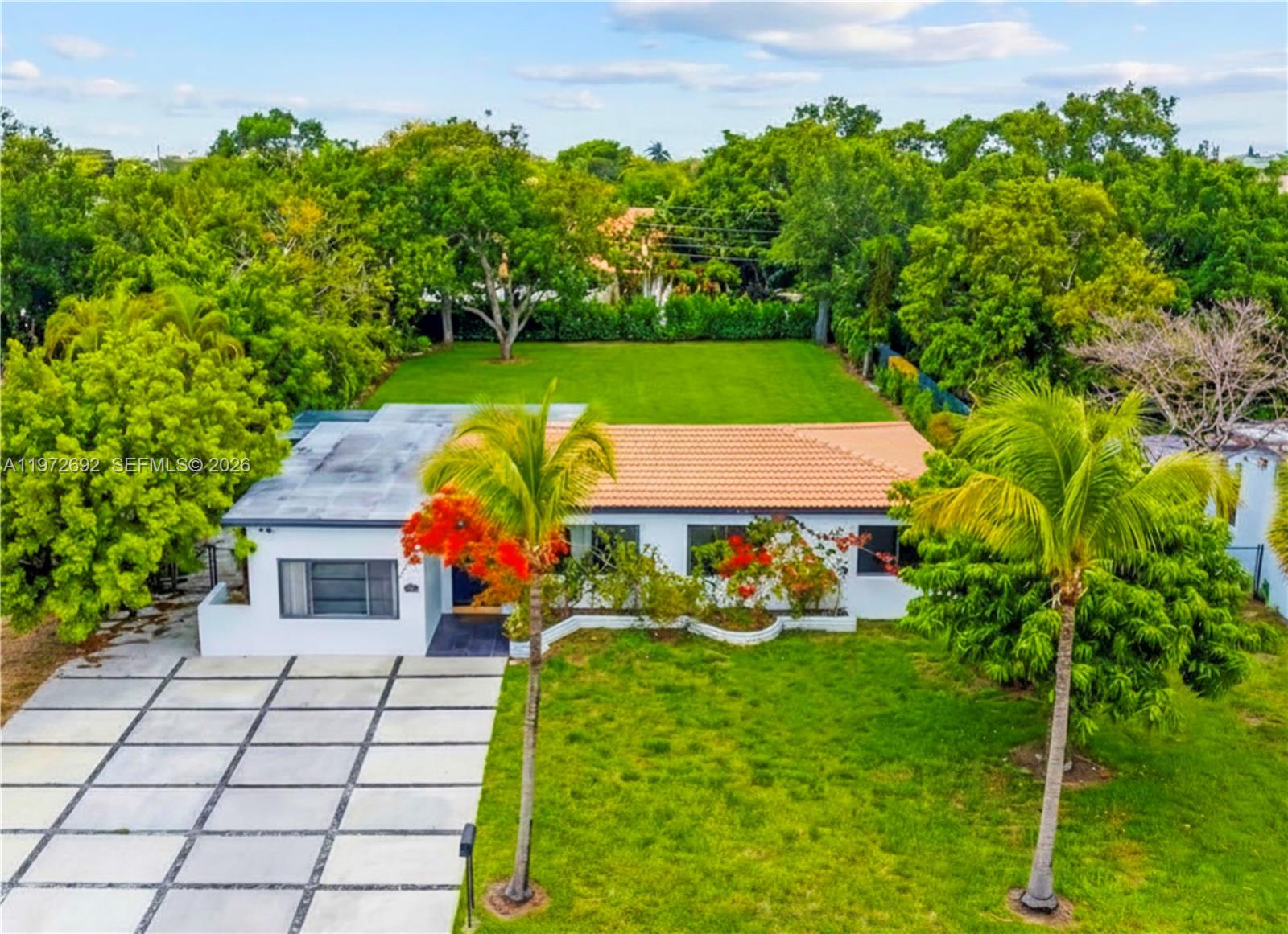 Rare opportunity in a high-demand corridor near Aventura, surrounded by major redevelopment and new construction. Positioned on an oversized lot with mature landscaping and privacy, this property combines immediate usability with strong long-term upside. The home features an updated kitchen, renovated baths, and updated flooring, making it well suited for end users, investors, or those looking to enhance further. Minutes to Aventura Mall, nearby waterways, major highways, and the Brightline Aventura Station, with convenient access to schools, houses of worship, parks, and hospitals.