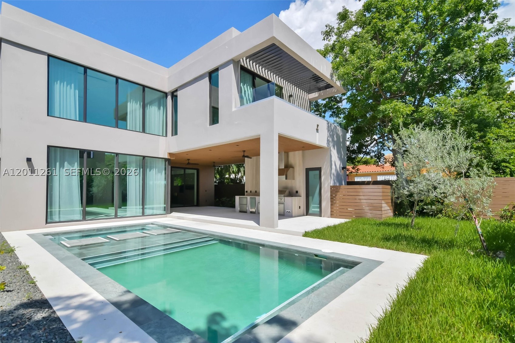 Brand new construction of an urban luxury living single family home in the Roads by Brickell. This exclusive residence features 6 bedrooms, 7,5 bathrooms, with 4,287 SF under AC and a total area of 5730 SF, high ceilings at 24 feet in the living and dining area, and 11 and 10 feet throughout the house. Custom Italian brand kitchen, top-of-the-line appliances, wine cellar, pantry, and laundry room, and maids/In-law room. Indulge in the swimming pool and jacuzzi with a sun deck, perfect for relaxation. Includes a BBQ grill summer kitchen and sauna.