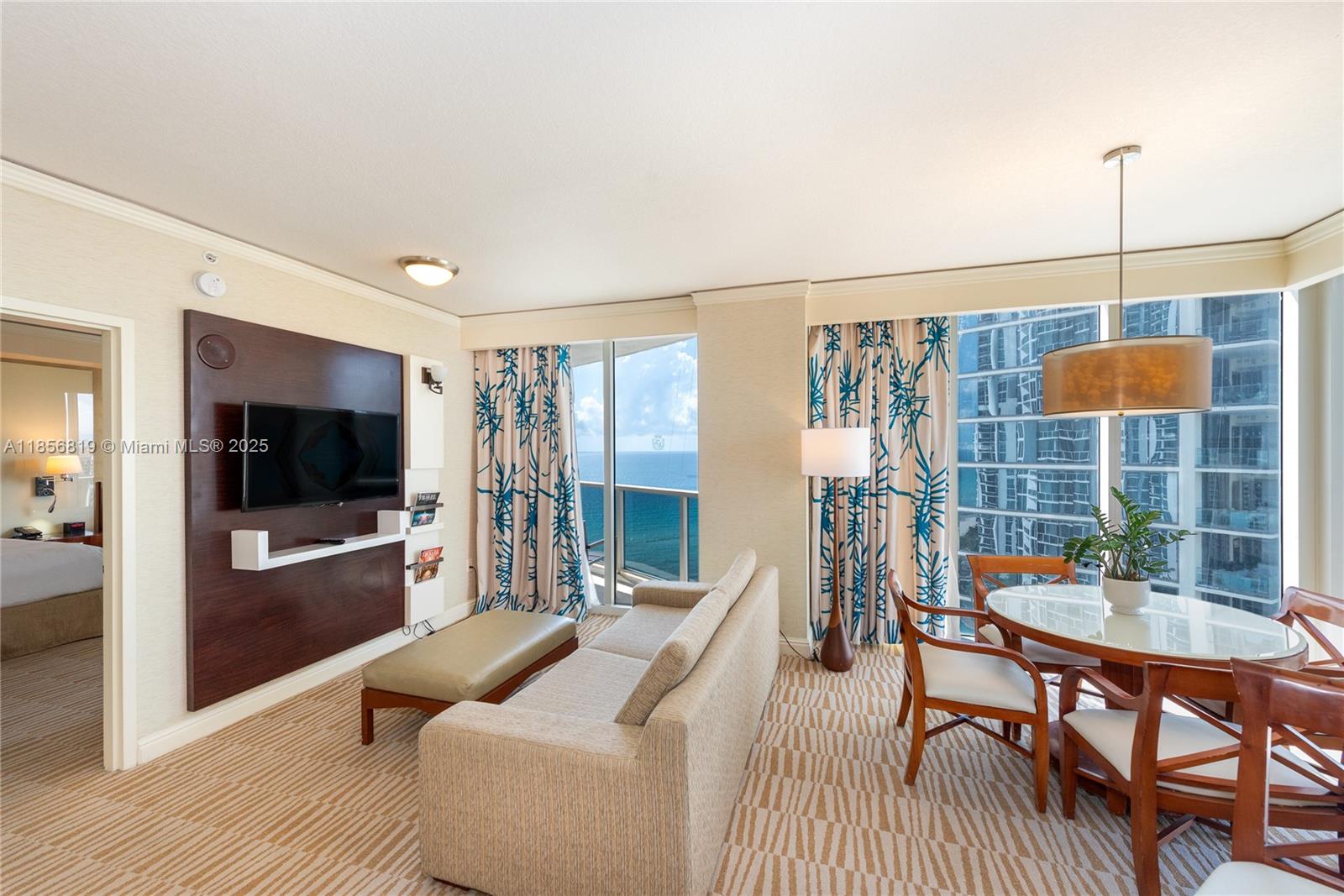 Located at Trump Intl Sunny Isles combines a studio and 1 bedroom suite—creating a versatile 2-bedroom residence (with 2 full baths) that can be rented separately or together, and is eligible for the  hotel program. On 12th floor, ocean views and abundant natural light. Fully equipped kitchen w/ oven, large refrigerator & microwave; a living room with a TV area; and a dining setup for four. Access all of Trump’s award-winning resort amenities, private beach access, dual pools (lap and grotto-style), spa and wellness & fitness center, multiple restaurants and pool bar, kids' programming, business center, valet and concierge services, and more. Ideal for seasonal strategies or long-term rental flexibility, this property offers turnkey investment branded by Trump International.