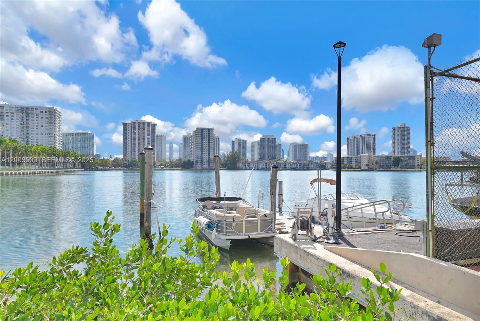 A ground-floor unit, fully furnished and featuring direct access—without the need for an elevator—from the parking area. This residence comprises one bedroom and 1.5 bathrooms, along with one covered parking space, spanning 887 square feet of air-conditioned living space. Notable features include a spacious bedroom, ample living areas, and a  facility conveniently located on the same floor.
Community amenities include 24-hour security, 2 swimming pools, tennis courts, a fitness center, a library, boat dock and access to the marina. It enjoys an ideal location in Aventura, close to top-rated schools, Aventura Mall, beaches, restaurants, and places of worship.