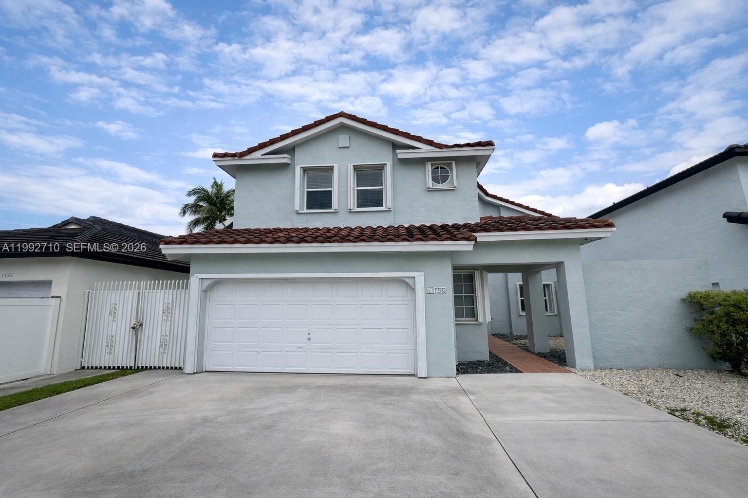 Beautiful lakefront home with NO HOA! Features a spacious open layout with vaulted ceilings and split floor plan. Kitchen and primary bedroom offer serene lake views, with large windows and sliding doors bringing in natural light. Enjoy a private patio, perfect for relaxing or entertaining. Includes dining area, breakfast nook/office space, updated features, elegant staircase, and accordion shutters. Located in a desirable school zone.