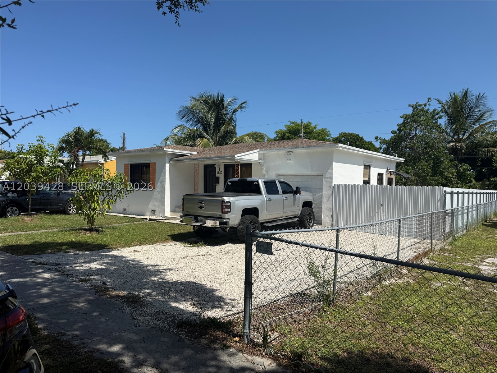 Discover the perfect blend of flexibility, comfort, and convenience in this well-maintained North Miami Beach home. Featuring a spacious main residence plus two separate in-law/guest suites, this property offers exceptional potential for multigenerational living, extended family accommodations, guest space, or additional income opportunities.

Recent updates provide peace of mind, including new impact windows, a new roof installed in 2019 and beautiful new tile flooring throughout completed in 2023. The kitchen was tastefully updated in 2023 with modern cabinetry and appliances, creating a functional and inviting space for everyday living.

Step outside to enjoy the property’s mature fruit trees, generous parking accommodations, and a covered outdoor entertainment area perfect for gatherings, barbecues, and year-round South Florida living.

Ideally located with easy access to major highways, shopping, dining, schools, and local amenities, this versatile property offers both convenience and value in one of North Miami Beach’s most accessible neighborhoods.

Don’t miss this unique opportunity to own a move-in-ready property with flexible living arrangements and endless possibilities.