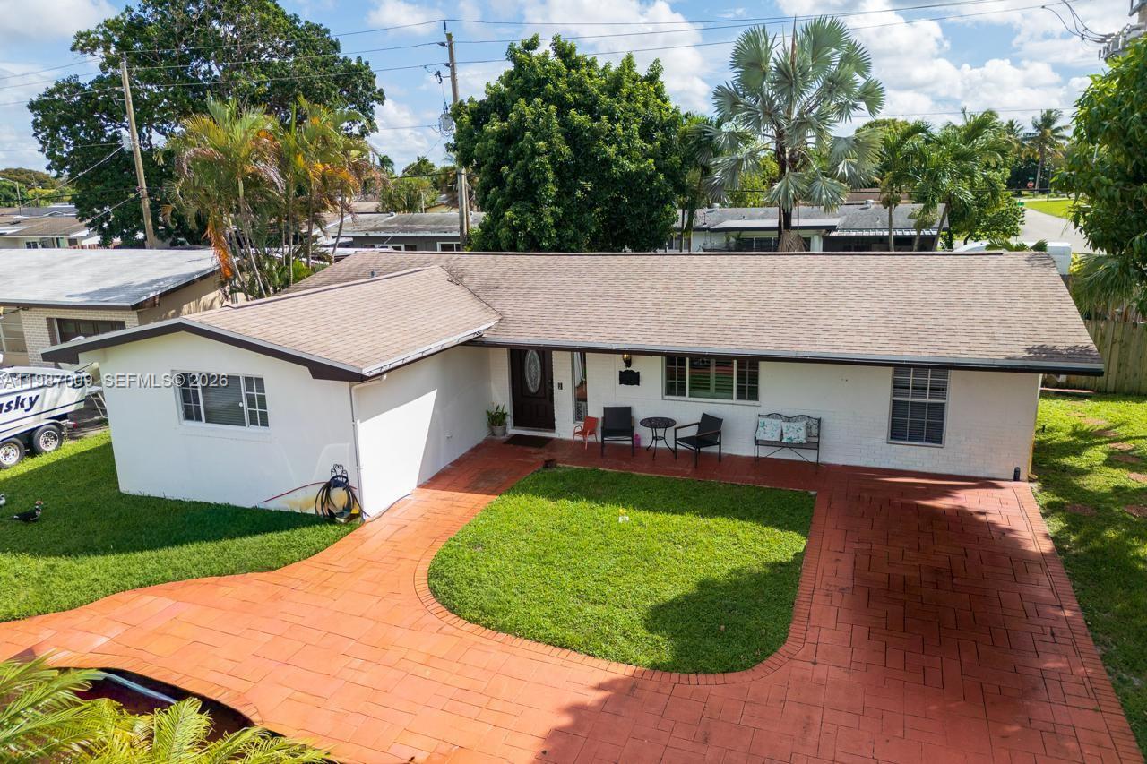 3B/2B Large Corner Lot! Well-maintained single-family home in Pembroke Pines. Features 3 bedrooms, 2 full baths, both with quartz countertops (remodeled master bath 2021). Kitchen with quartz countertops, wood cabinetry, stainless steel appliances, open dining/living room area, family room, den/office with French doors with large windows with view to backyard. Stamped concrete circular driveway, fully fenced yard, and sprinkler system. No HOA. New roof installed in 2021, water softer/filtration system installed in 2021, and water heater installed in 2021. Close to schools, highways, shopping mall and hospitals. Close proximity to dog park and play lot.