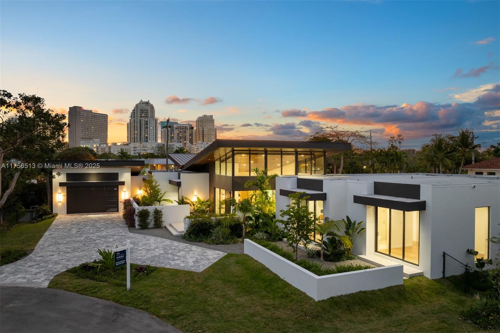 Discover mid-century modern in this brand-new 1-story estate, completed in 2025 in the exclusive cul-de-sac community of The Grove at Pinecrest. This architectural gem boasts a seamless open-concept layout, elegant finishes, and expansive impact windows. Enter through a sleek foyer with porcelain floors flowing into formal living and dining areas. A custom wet bar complements the spacious family room. The chef’s kitchen features custom cabinetry, top-of-the-line Thermidor appliances, gas stove, and Quartz countertops. Step outside to a private oasis with a stunning pool, tanning ledge, and lush landscaping. Use GPS: 6901 SW 91 St.