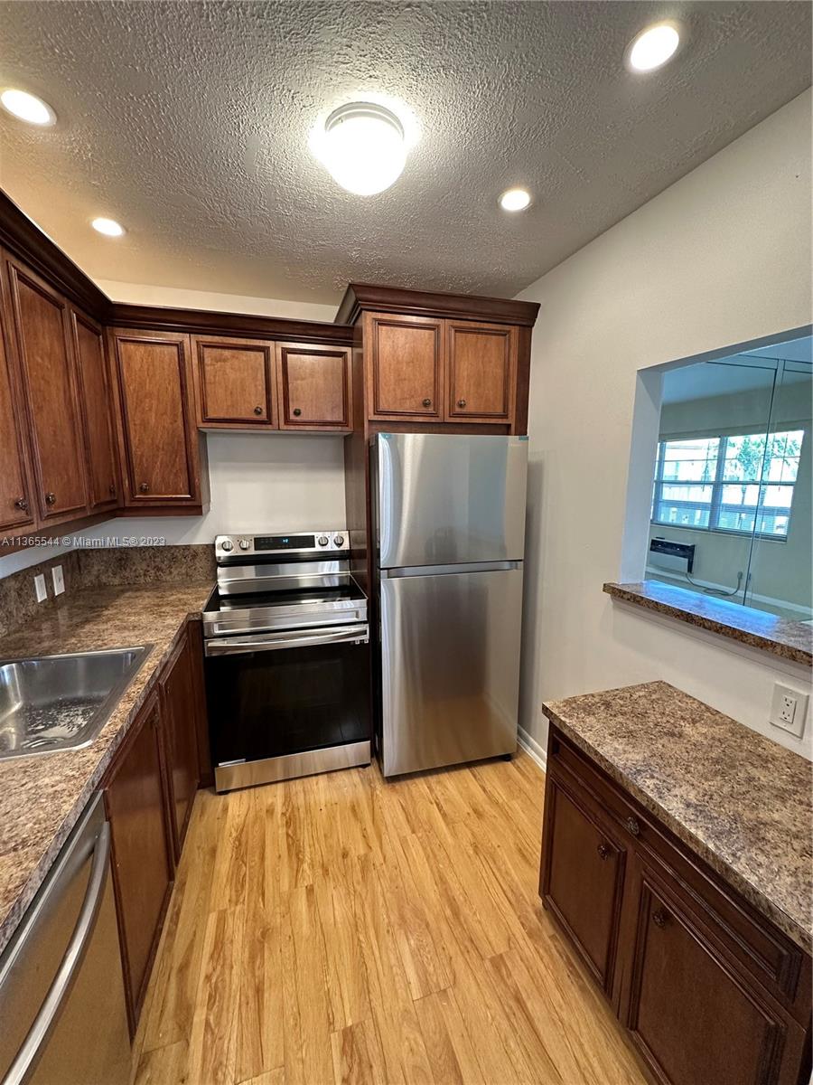 Updated 1BR/1.5 Bath Condo in Century Village Boca Raton.   Enjoy all the activities and amenities that Century Village is known for!   Incredible Clubhouse with fitness center, Community pool, sauna, theatre, gameroom, shows, and many activities.   Kitchen with all new Stainless Steel Appliances.  Both bathrooms have been updated with new vanities and toilets.   Very pleasant garden view from balcony.  Balcony also has tile.   Storage bin included.   Condo fee also includes cable, and internet!