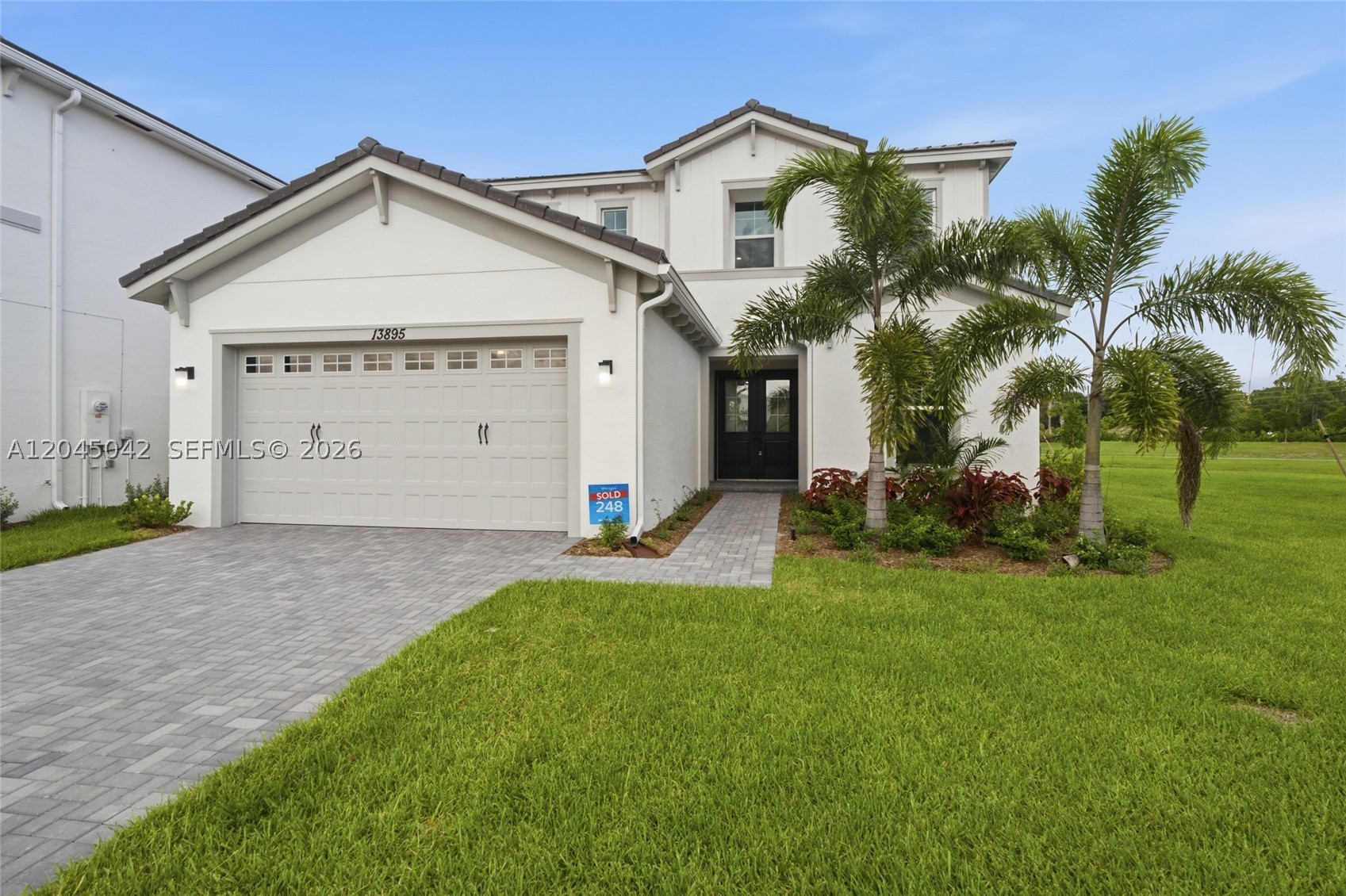 Welcome to this stunning Azalea Grand model located on a lakefront cul-de-sac lot in the desirable resort-style community of Westlake! This beautifully upgraded 4-bedroom, 3.5-bath home offers 2,814 square feet of thoughtfully designed living space with over $60,000 in upgrades. The functional floor plan features a first-floor bedroom and full bathroom, ideal for guests or multigenerational living. The spacious kitchen opens seamlessly to the living and dining areas, creating the perfect setting for everyday living and entertaining. Additional upgrades include a tankless gas water heater and gas dryer. Upstairs, the versatile loft can easily be converted into a fifth bedroom, home office, or media room. Enjoy peaceful lake views and the privacy of a cul-de-sac location while taking advantage of Westlake's exceptional resort-style amenities, including pools, parks, playgrounds, and recreational facilities. Don't miss the opportunity to own this move-in-ready home in one of Palm Beach County's fastest-growing communities!