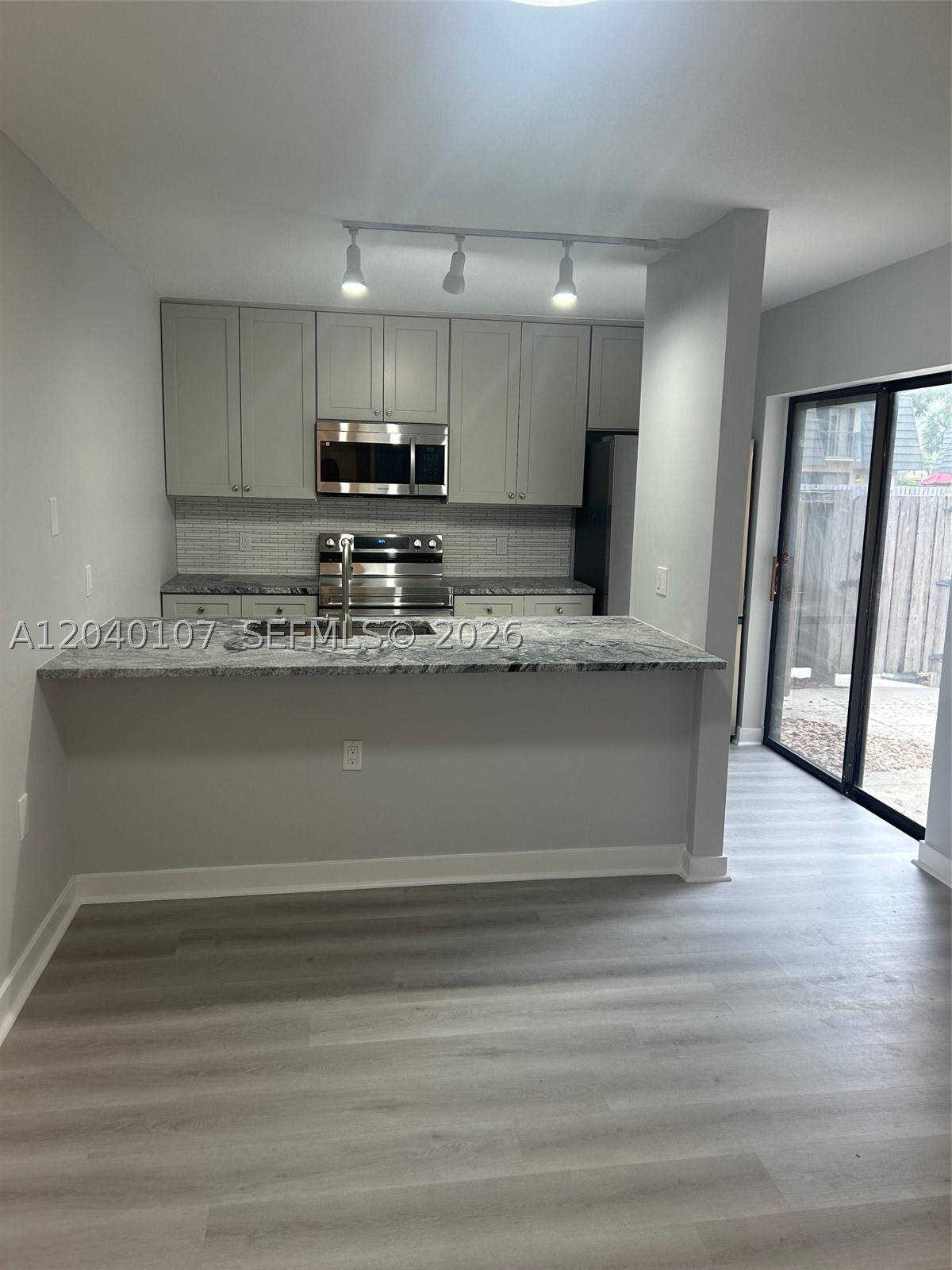 Renovated 2 bed 2 bath TH, LVT flooring downstairs, carpet upstairs, SS appliances, hurricane panels. Great central location, I95, PBI, shopping. $1,000 Capital contribution upon purchase