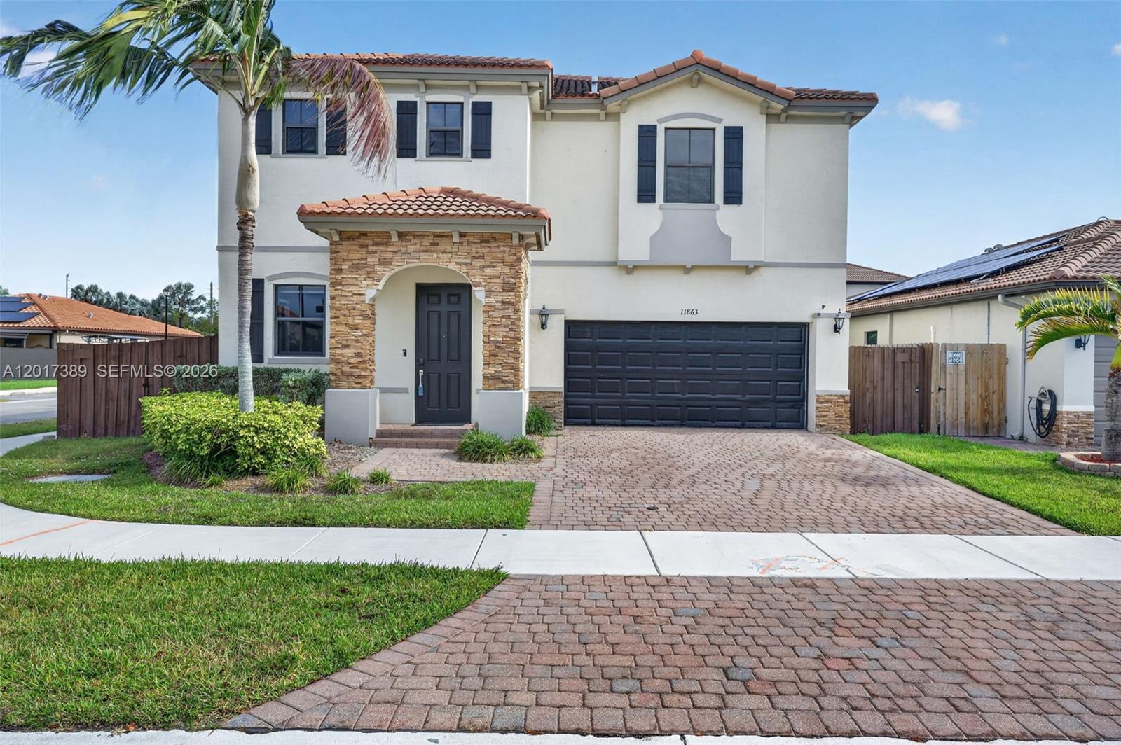 Beautifully upgraded 5-bedroom, 3-bath home located in the highly sought-after Silver Palms community. Built in 2016 and offering over 3,300 SqFt of living space, this move-in-ready residence combines modern style, functionality, and comfort. Situated on a premium corner lot, the home offers added privacy, extra yard space, and impressive curb appeal. The open-concept floor plan features elegant tile flooring downstairs, spacious living and dining areas, and a chef’s kitchen with ceiling-height cabinetry, quartz countertops, waterfall island, stainless steel appliances, spice cabinet, coffee bar, and ample storage. Ideal for guests or multigenerational living, the first floor includes a private bedroom and full cabana bath. Upstairs features updated vinyl flooring, spacious secondary bedrooms, a convenient laundry room, and a large primary suite with custom walk-in closet and spa-inspired bath with dual vanities, Roman tub, and separate shower.
The fully fenced backyard is perfect for entertaining with an extended marble-paved patio, ambient lighting, and room for a pool. Additional highlights include a 2-car garage, paver driveway, and excellent curb appeal.
Silver Palms residents enjoy resort-style amenities including clubhouse, pool, fitness center, playgrounds, sidewalks, and security patrol with low HOA fees. Conveniently located near shopping, dining, schools, parks, and major highways. A must-see opportunity in one of South Miami-Dade’s most desirable communities!