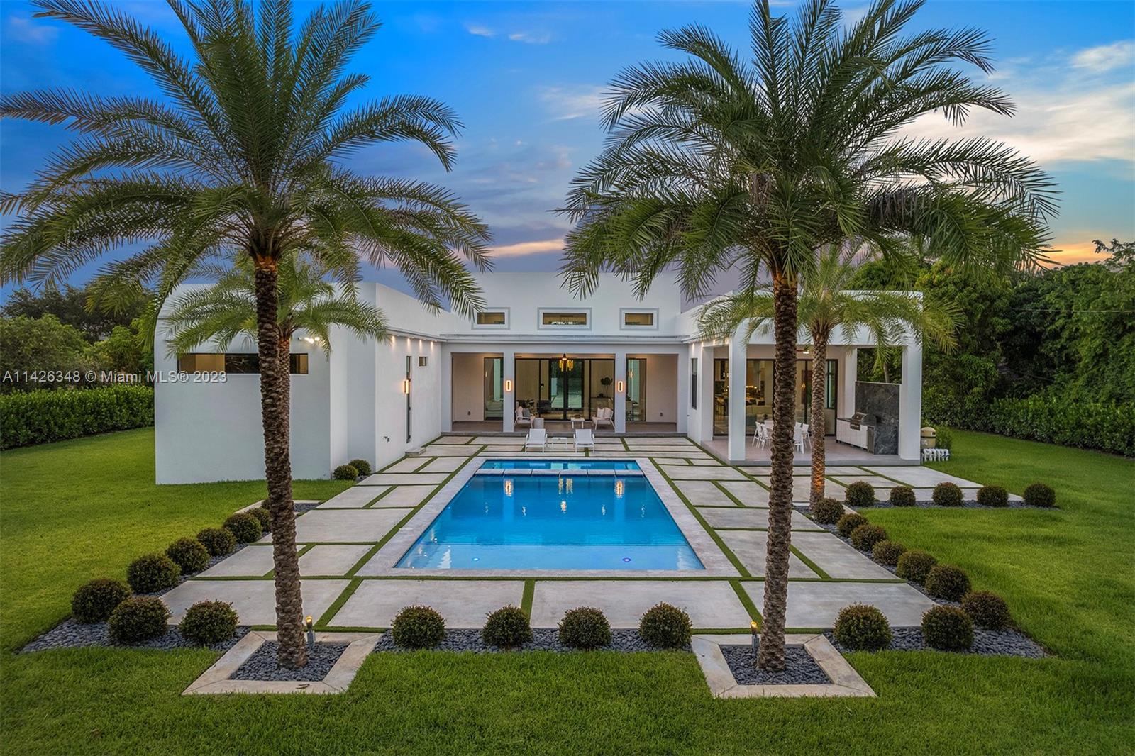 Exquisite 2023 brand-new construction on over an acre of walled & gated splendor, showcasing modern luxury finishes & impeccable details throughout. Discover an exceptional open flrplan, offering 5 beds & 6/1 baths, grand living areas, high ceilings & an abundance of natural light in every room. Enjoy a chef's dream kitchen w/ quartz countertops & Thermador appliances that harmoniously connect to a breakfast area overlooking the family room. Lavish master suite w/ his/hers walk-in closets, a spa-like bath featuring a soaking tub, large shower & access to the backyard. Enjoy the vast outdoor setting w/ ample green grounds, large covered terraces, built-in summer kitchen, & captivating pool/spa w/ a tanning ledge. Additional highlights incl. impact win/drs, & a spacious 4-car gar.