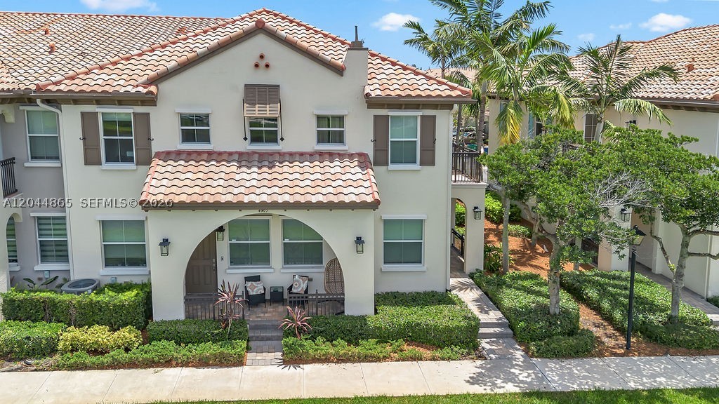 Spectacular corner unit townhome in the gated community of Monterra. This open concept townhouse with 2 bedrooms and 2 bathrooms has a circular stair that leads you to a loft space (ideal for an office or guest room). This rental  property  makes you want to stay. It is super ample , has vaulted ceilings, laundry room, 2 car garage and a terrace right off the living space. The property has all IMPACT WINDOWS, impact garage door, a kitchen with a lot of cabinetry, the principal bedroom has a large ensuite bathroom with a walk-in closet, and the second bedroom has a separate bath. Monterra feautures a community pool, lakes, and walking paths for all residents.MOVE IN READY! IMPECCABLE!!