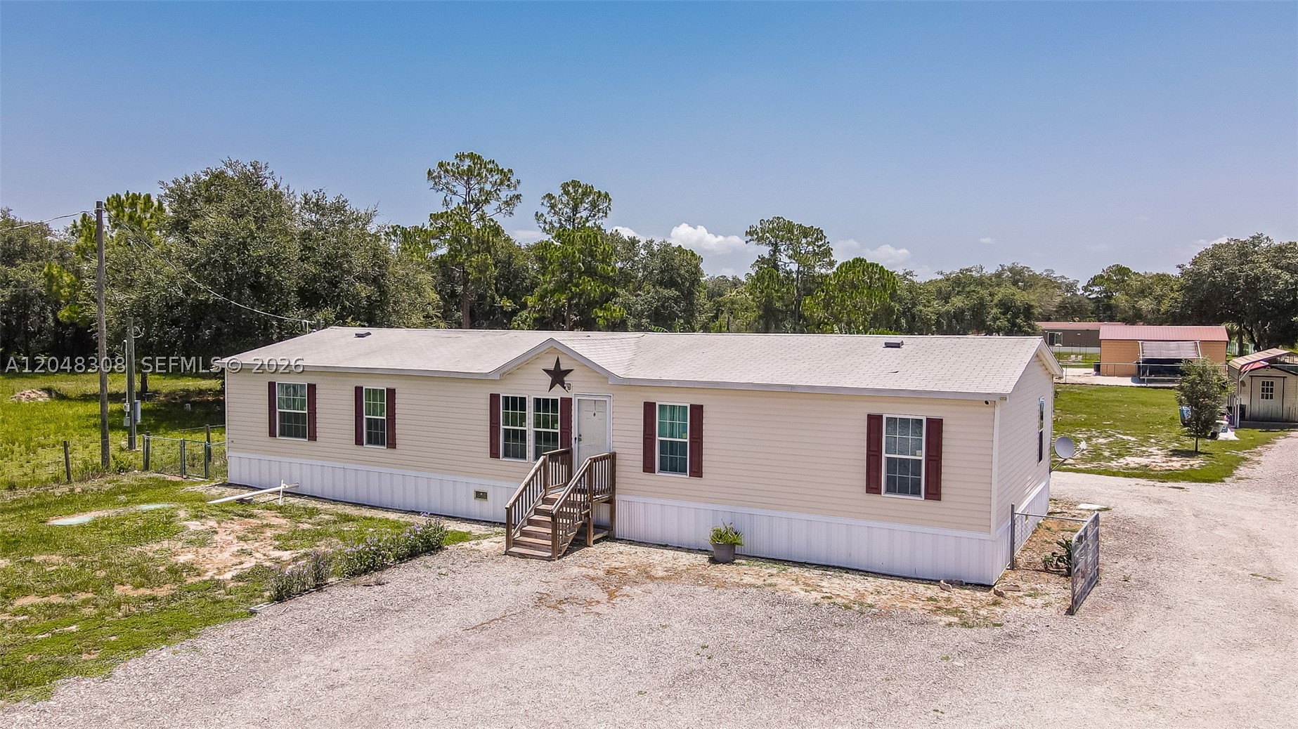 AMAZING OPPORTUNITY TO BUY THIS MANUFACTURE-HOME IN MONTURA RANCH. This home is situated on a private lot (1.25 Acres), with the BEST of living in a rural setting. This DOUBLE WIDE manufactured home has spacious living area with 4 bedrooms and 2 bathrooms. 
Montura Ranch Estates is a rural community of South Central Florida in Hendry County residing between the cities of Clewiston and LaBelle. Centrally located within 1-1.5 hours from Miami, Naples, Fort Myers, Cape Coral, Fort Lauderdale, West Palm Beach, Port Charlotte and Okeechobee. Zoning RRF (Rural Residential Farm)