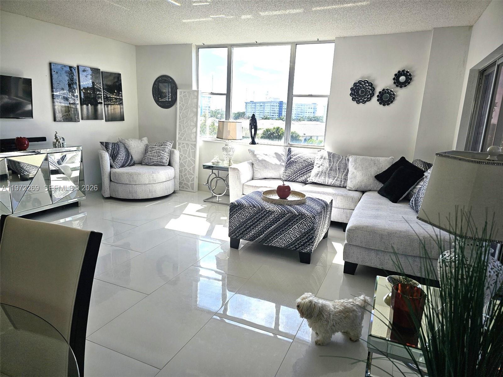 Experience Waterview Luxury Living in Hillcrest. Mostly renovated Corner unit- elegant, spacious, bright 2-bed, 2-bath condo in newly upgraded 55+ community. Enjoy stunning water & garden view from big screened balcony. Large designer white tiled floors, all white kitchen, HUGE Master suite including vanity area and really big Walkin closet, large guest room. Newer AC, Hot Water heater, Refrigerator, Dishwasher and Range. This well-maintained building features fire sprinklers, completed 40-year safety inspection, and 24/7 security, lobby attendant. HOA includes cable, internet, water. Resort-style amenities: heated pool & jacuzzi, clubhouse with indoor kitchen & outdoor bar/BBQ, tennis & pickleball courts, and scenic walking trails. Prime location near beaches, fine dining, worship, shopping, Fort Lauderdale Airport, Hard Rock Hotel, Gulfstream Park, and the Hollywood Boardwalk also 95 & Tpk. 20% down required, no leasing, 670 Credit score required.
A rare find! Text or Call now to schedule your private tour today!