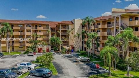 Beautifully renovated 2/2 condo in a well-maintained elevator building with serene lake views. This bright and spacious 1,074 sq ft unit features a modern open layout, zebra shades, updated flooring, fresh paint, and abundant natural light. The upgraded kitchen offers white shaker cabinets, quartz countertops, stainless steel appliances, and a convenient pass-through to the dining area. The primary bedroom includes private balcony access, a large walk-in closet, a vanity area, and a remodeled walk-in shower. The second bedroom is generously sized with easy access to an updated guest bathroom. Hallway offers two linen closets for extra storage. Laundry room is located on the same floor. Secure keypad entry and easy unit access—exit elevator, turn left, then left. Enjoy peaceful lake and garden views from the screened-in balcony accessible from the living room and primary bedroom. Community with ample parking and lush landscaping. Conveniently located near shopping, dining, schools, parks, and major roadways.