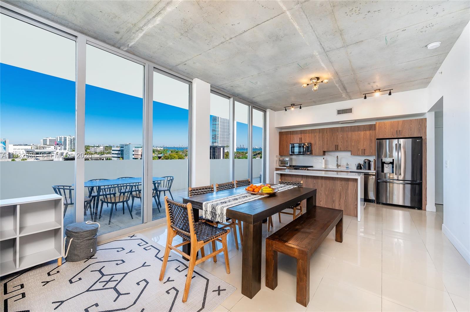 Modern luxury living in the heart of Midtown Miami. This 2 bedroom, 2 bathroom northwest corner residence at TWO Midtown offers 1,242 square feet of interior living space and an impressive 639 square feet of wraparound terraces, creating an ideal indoor outdoor lifestyle.

The bright, open floor plan features soaring exposed concrete ceilings, floor to ceiling windows, and abundant natural light throughout. A fully remodeled kitchen and bathrooms showcase contemporary finishes and refined details, while oversized windows capture dynamic city views from every angle.

TWO Midtown is a full service luxury building offering resort style amenities including a state of the art fitness center overlooking Biscayne Bay, a heated swimming pool with cabanas, three temperature controlled dipping pools, a Jacuzzi, sauna, and steam rooms, yoga and lounge terrace, and an outdoor children’s play area. Ideally located just steps from Midtown’s shops, dining, and entertainment, with close proximity to Wynwood, the Design District, Miami Beach, and Downtown Miami.
