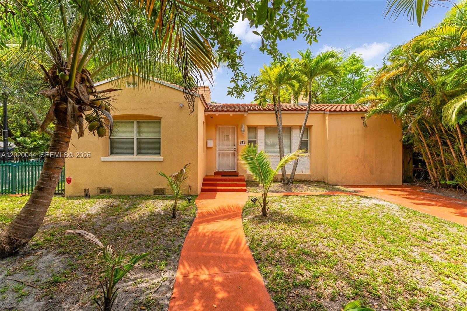 Miami bungalow located in the heart of historic Buena Vista, a sought-after and architecturally rich neighborhood just steps from the Design District. This detached corner single-family home blends timeless charm with modern updates, featuring original hardwood floors, a statement fireplace. A nice size kitchen and eat in area great for morning coffee. The home offers 2 bedrooms and 2 bathrooms. Enjoy gated off-street parking and a 5,220 sq ft corner lot offering flexibility for future improvements, subject to buyer verification with the City of Miami. A rare opportunity to own a character-filled residence minutes from Wynwood, Midtown, and Biscayne Bay.