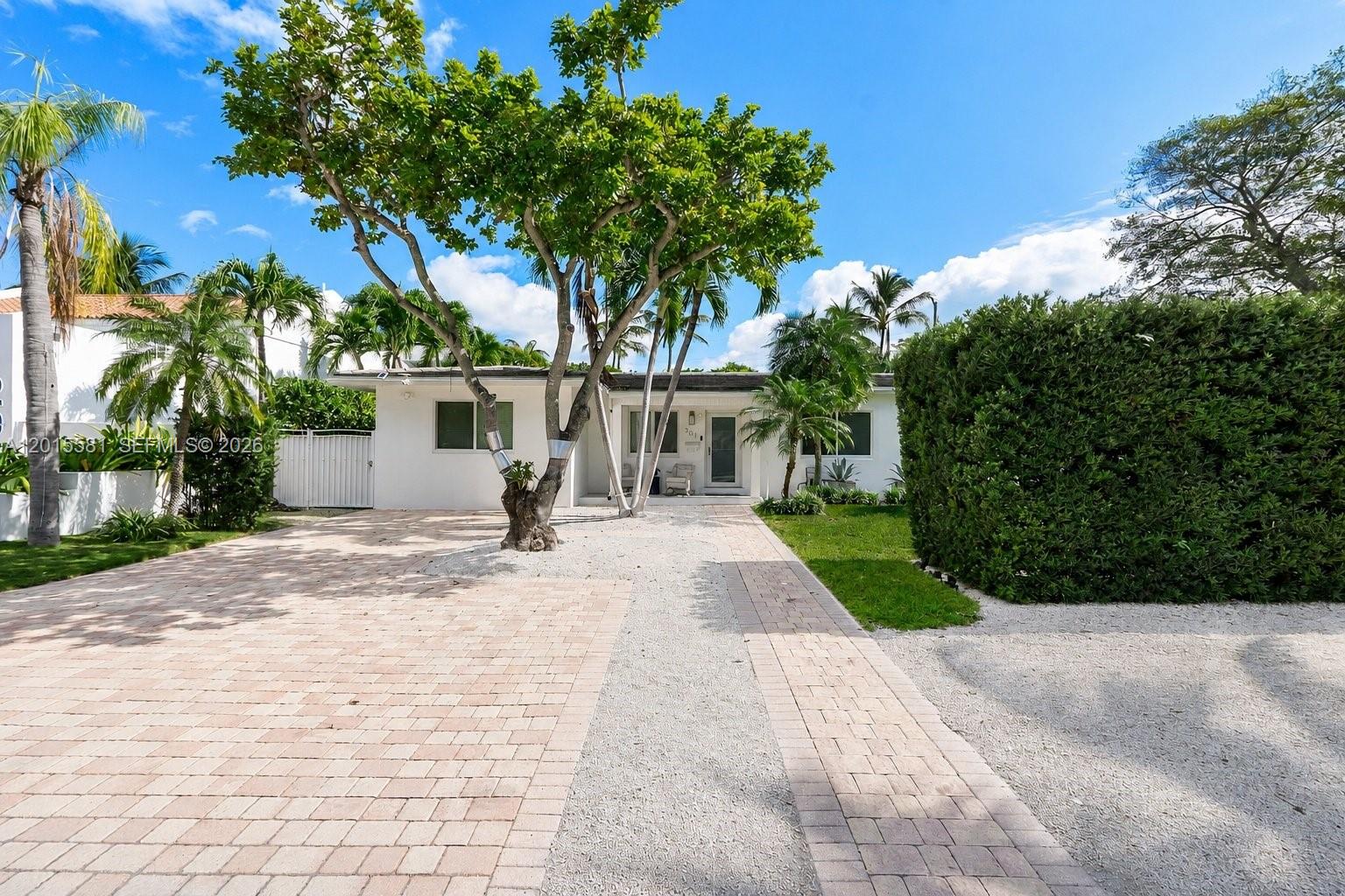 Experience refined island living in Key Biscayne, a true paradise just minutes from downtown Miami. This beautifully renovated residence offers 4 bedrooms, a private office and 3 bathrooms. The chef's kitchen showcases premium appliances and generous counter space, seamlessly flowing into bright family room, dining and living areas ideal for both everyday living and entertaining. Impact windows and doors enhance security and efficiency throughout. Step outside to your private tropical oasis featuring a heated saltwater pool, lush landscaping, and inviting outdoor spaces perfect for relaxation. Beach Club membership. A rare opportunity to own a slice of paradise in one of most exclusive island community.
