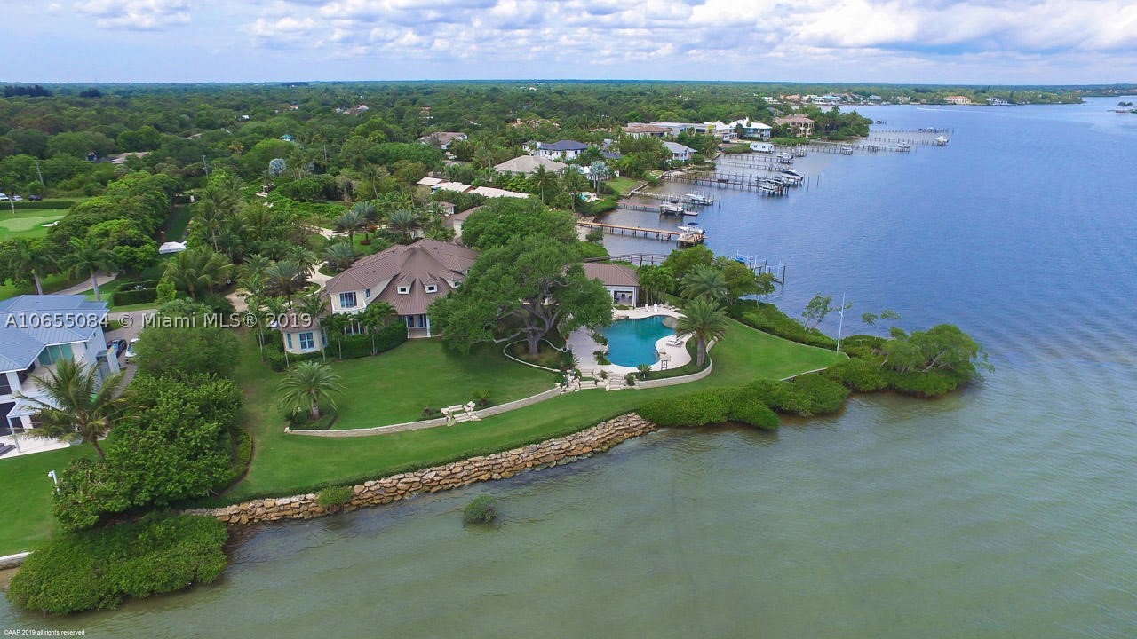Boasting 599 feet of waterfrontage and incredible, panoramic views of the River, this private oasis located on the wide-waters of the Loxahatchee River has reset the standard of luxury in South Florida. The custom estate home vaunts expert craftsmanship and an array of state-of-the-art features that will leave you simply amazed.