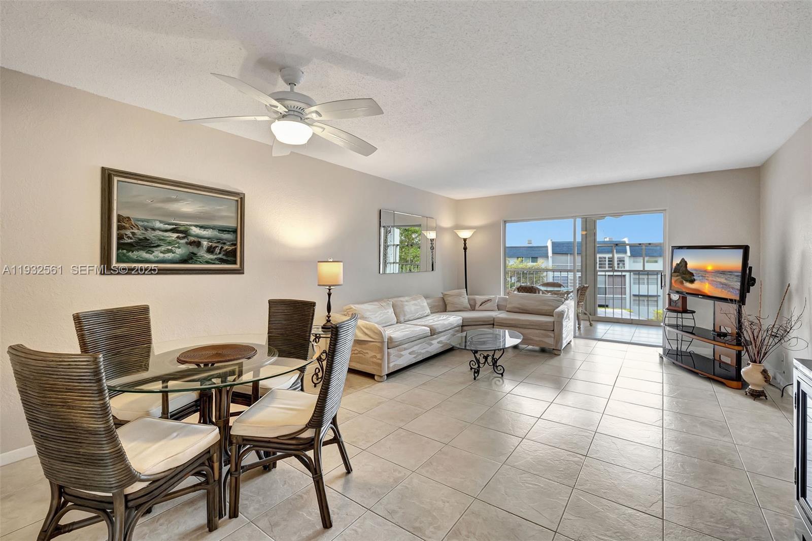 PRICE REDUCED TO SELL NOW - DEAL- DEAL- DEAL -This stunning 2-bedroom & 2-bathroom unit is located in the desirable Oriole Golf & Tennis community. The modern kitchen features white cabinets & granite countertops. The master bathroom has been renovated with an exquisite porcelain shower, showcasing a luxurious marble look. Tile flooring throughout the living area, while the bedrooms are adorned with laminated wood floors. Could be yours all furnished, ready to move in. Step out onto the screened-in balcony and enjoy fun views of the game area and the pool, complete with brand-new shutters for added protection. The community offers amenities, including a pool, shuffleboard, outdoor grills and a gym. Directly on the 3rd floor with nobody on top of you! Don't wait, it will be gone
