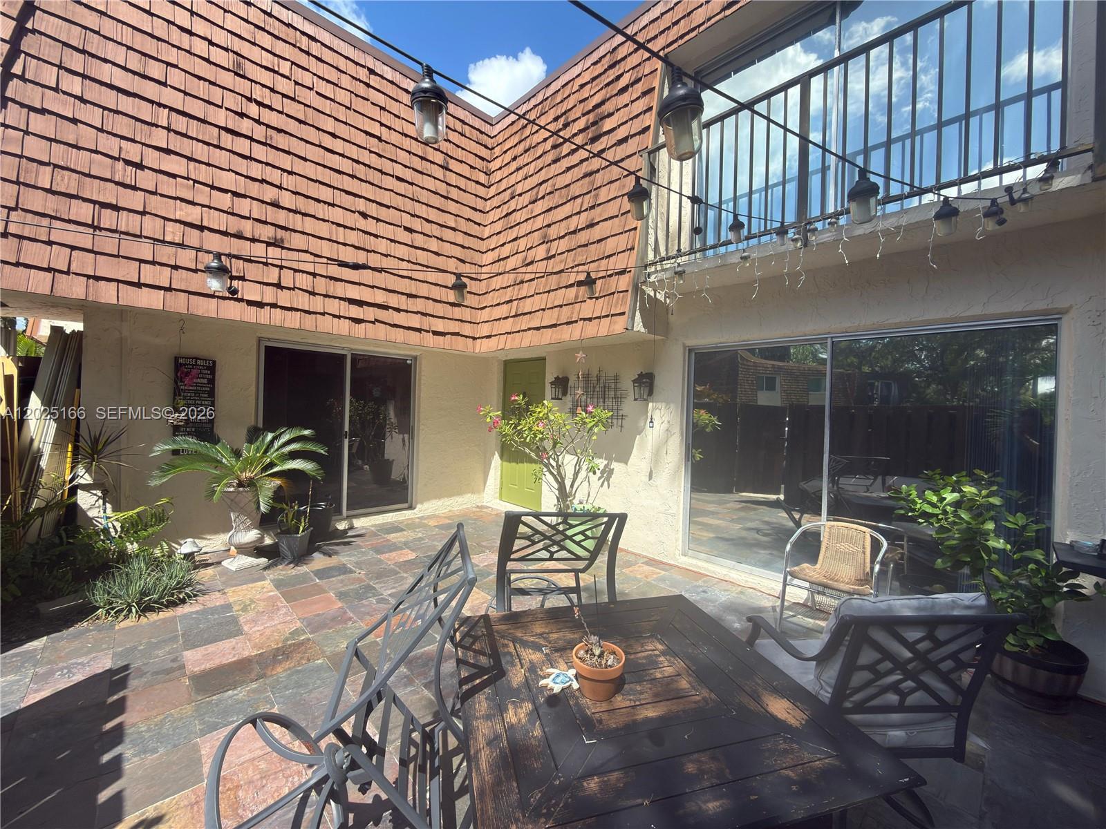 Beautifully maintained 2/2.5 townhome in the heart of Davie offering modern comfort and convenience. This spacious residence features an open-concept floor plan with abundant natural light, updated finishes, and a functional layout ideal for everyday living and entertaining. The kitchen showcases contemporary cabinetry, countertops, and stainless steel appliances overlooking the living and dining areas. Upstairs, generously sized bedrooms provide comfort and privacy, including a spacious primary suite with ample closet space and a bathroon in each bedroom. Enjoy a private patio area perfect for relaxing or entertaining guests. Conveniently located near top-rated schools, shopping, dining, parks, universities, and major highways. A fantastic opportunity to own in one of Davie’s most desirable communities.