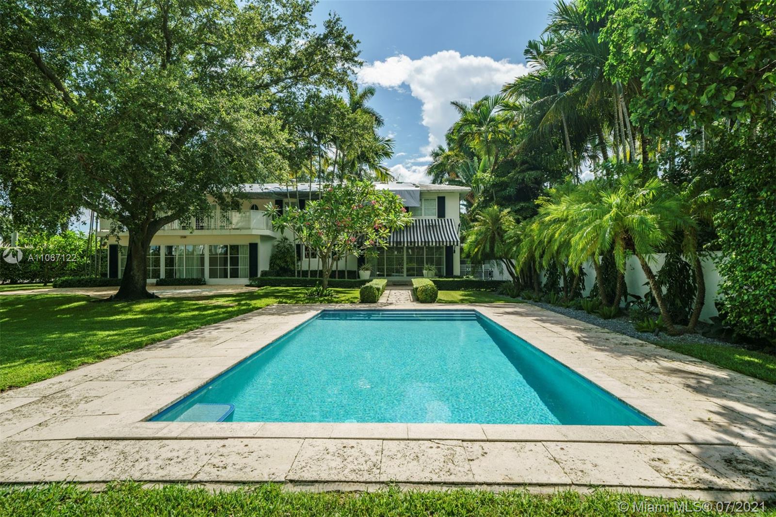 Live on one of the most coveted private, guard-gated islands in Miami Beach, La Gorce Island. Sitting on an expansive, corner 17,988 square foot lot this estate was renovated to perfection, with no detail spared all while maintaining the original charm of the home. The open floorplan allows for a great flow through of spaces, natural light and views overlooking the stunning landscaped verdant outdoors & the outdoor living spaces & beautiful pool. Boasting 4 bedrooms, 4 full bathrooms, 1 half bath, 4,086 total square feet, a gourmet chef’s kitchen with top-of-the-line appliances, ensuite bedrooms, a principal suite with walk-in closets, a balcony overlooking the outdoors & a 2 car garage. Located in close proximity to the beach, world-class restaurants and all that Miami Beach has to offer.