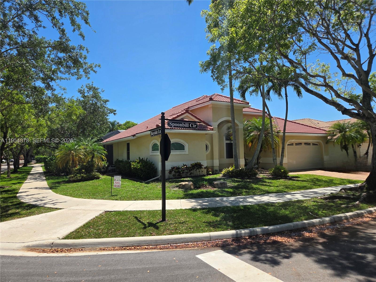 WOW!!!  BEST DEAL/DREAM HOME IN ORCHID ISLAND/WESTON!
2013 NEW ROOF, 2022 HIGH-IMPACT WINDOWS with HURRICANE-PROOF DOORS throughout and 2016 A/C for peace of mind and maximum insurance discounts.
Awesome and Spacious, Tranquil, and Charming One-story Corner home, offering 5 Bedrooms and 3 Bathrooms freshly painted, perfectly situated in a corner Lot of the prestigious and highly sought-after Orchid Island community, NOW BELOW MARKET! 
This private, man-gated enclave features only 129 residences, ensuring an exclusive and serene living environment. 
MODERN CONFORT AND STYLE!
Enjoy everyday comfort with recently renovated bathrooms and an upgraded kitchen. The heart of this home features volume ceilings, elegant wood cabinetry, and stunning granite countertops. The open-concept layout seamlessly integrates the kitchen, dining, and bright living areas, with a breakfast area perfect for casual meals and gatherings. 
OUTDOOR LIVING AND SECURITY!
Step outside to a covered back patio and a private, screened, pavered Swimming Pool—ideal for relaxation and entertaining guests.  
COMMUNITY FEATURES AND LOCAL AMENITIES!
Excellent parks, shopping, houses of worship, and outstanding dining. Served by some of South Florida’s best “A” rated Public Schools. Community amenities include tennis courts, a half-court basketball area, and a dedicated children’s play area, making this the perfect home for both relaxation and an active lifestyle.
NOTE: Ceiling Light Fixtures are Excluded.